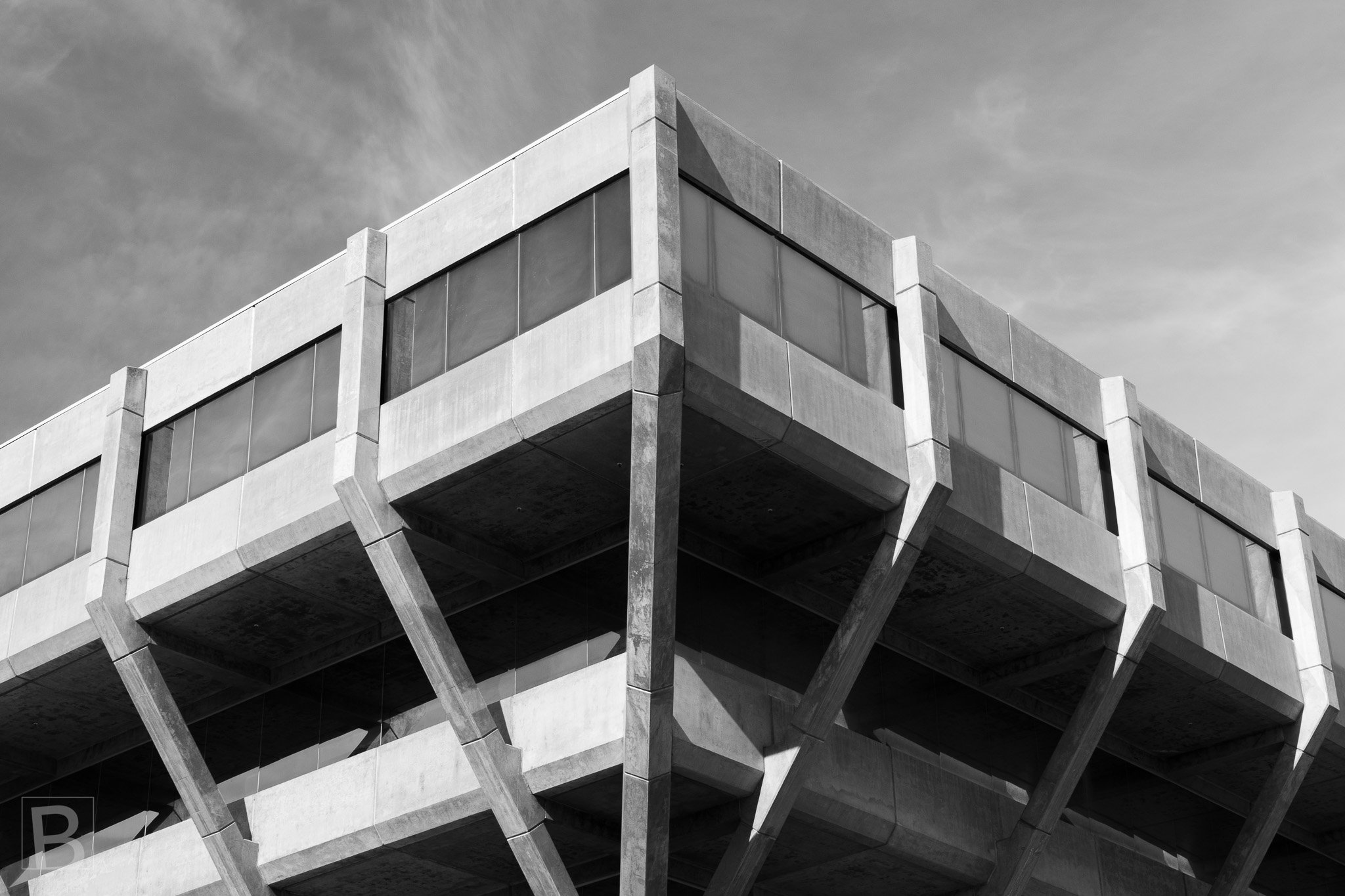 Close-up fine art photograph of Brutalist concrete architecture
emphasising texture, structure and light.