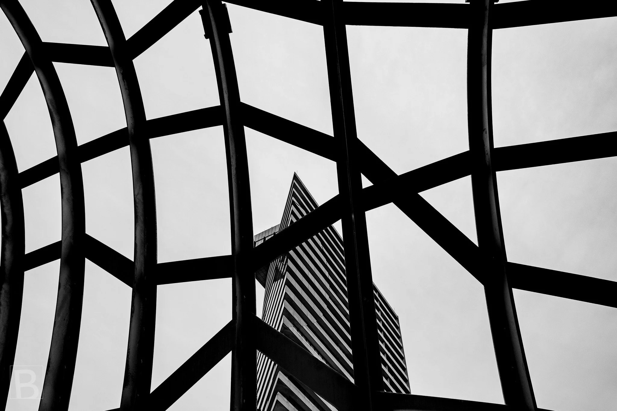 Intersecting bars reshape the familiar city tower into an abstract
arrangement of lines, angles and enclosed sky.