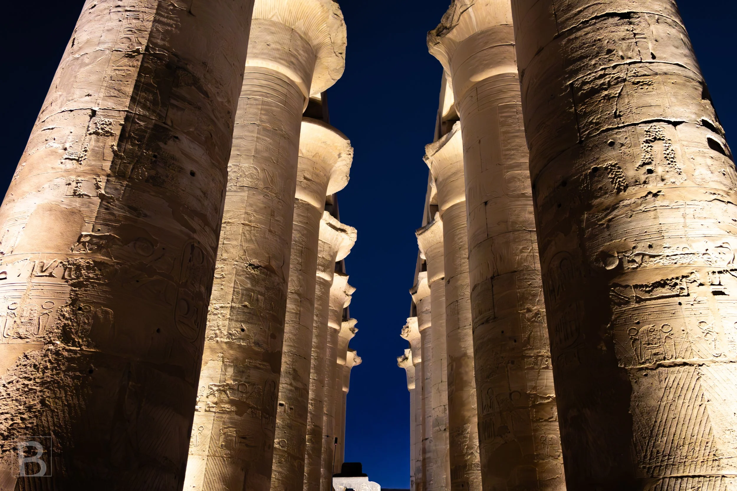 Artificial light separates carved shafts from the blue-black sky,
revealing rhythm and texture after dark.