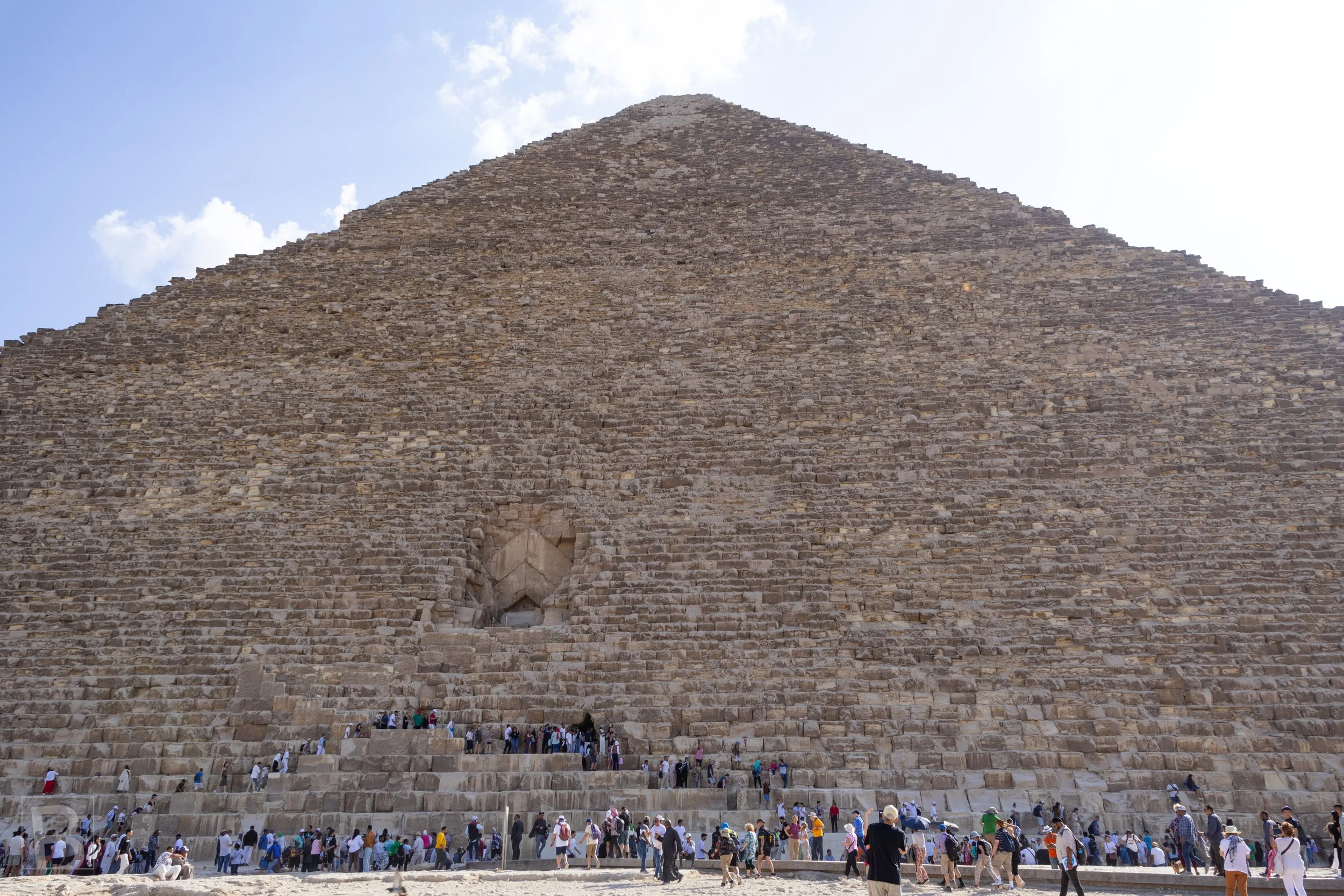 Human figures reveal the immense scale of limestone blocks
assembled into Egypt's most enduring monument.