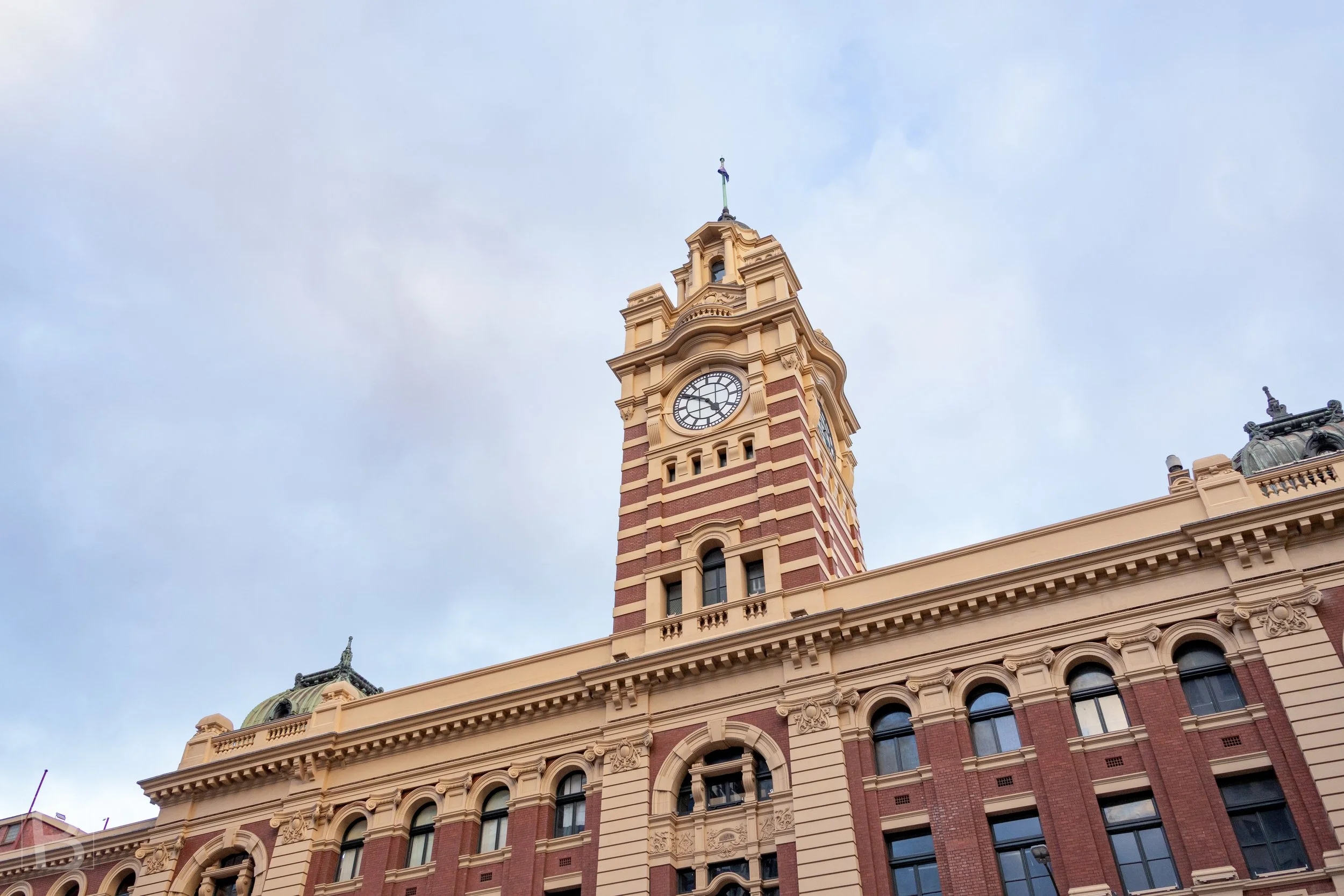 A prominent clock tower anchors the richly detailed civic architecture
below, reflecting the confidence of Victoria's regional building boom.