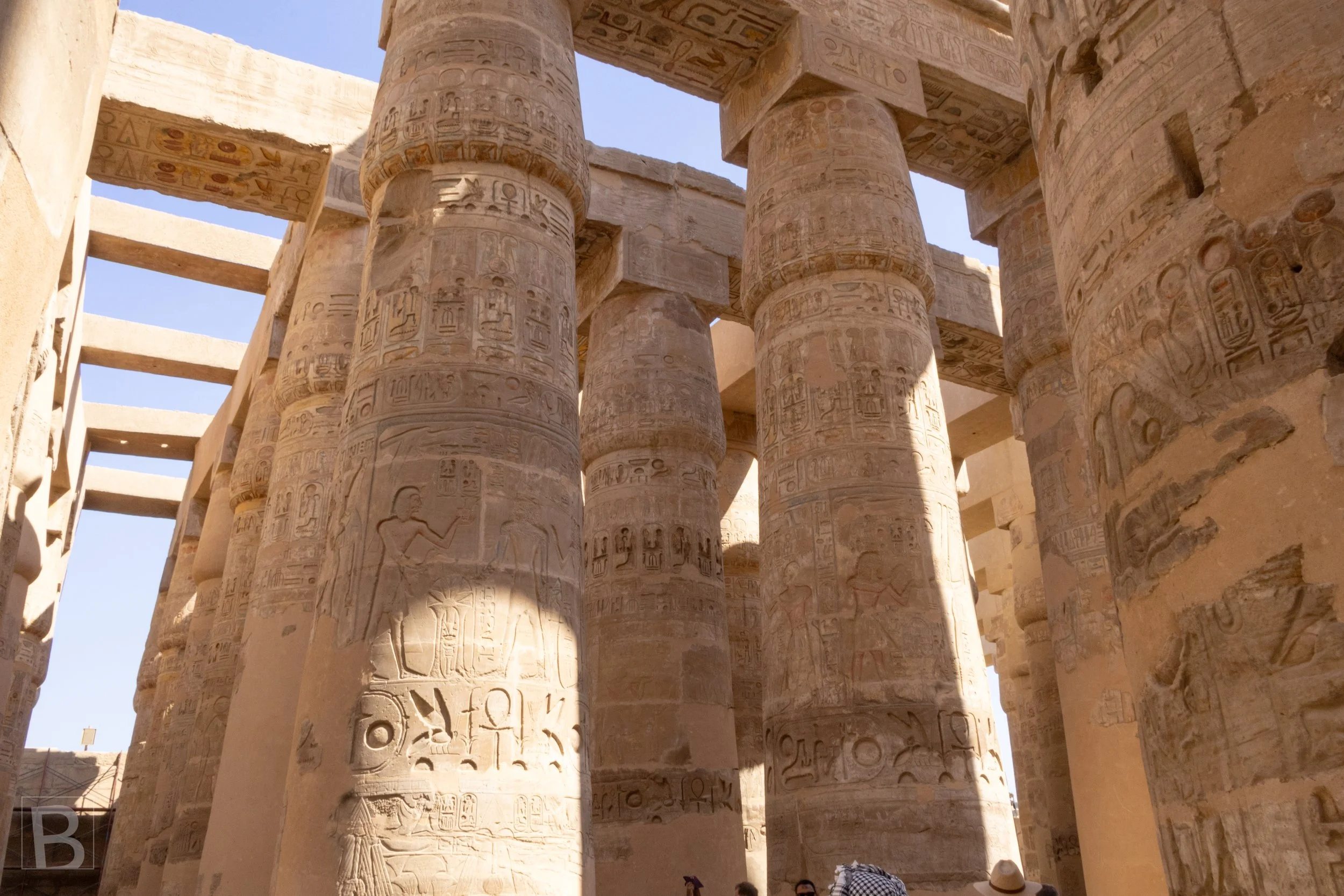Sunlight moves across carved shafts and capitals within one of
ancient Egypt's greatest architectural spaces.