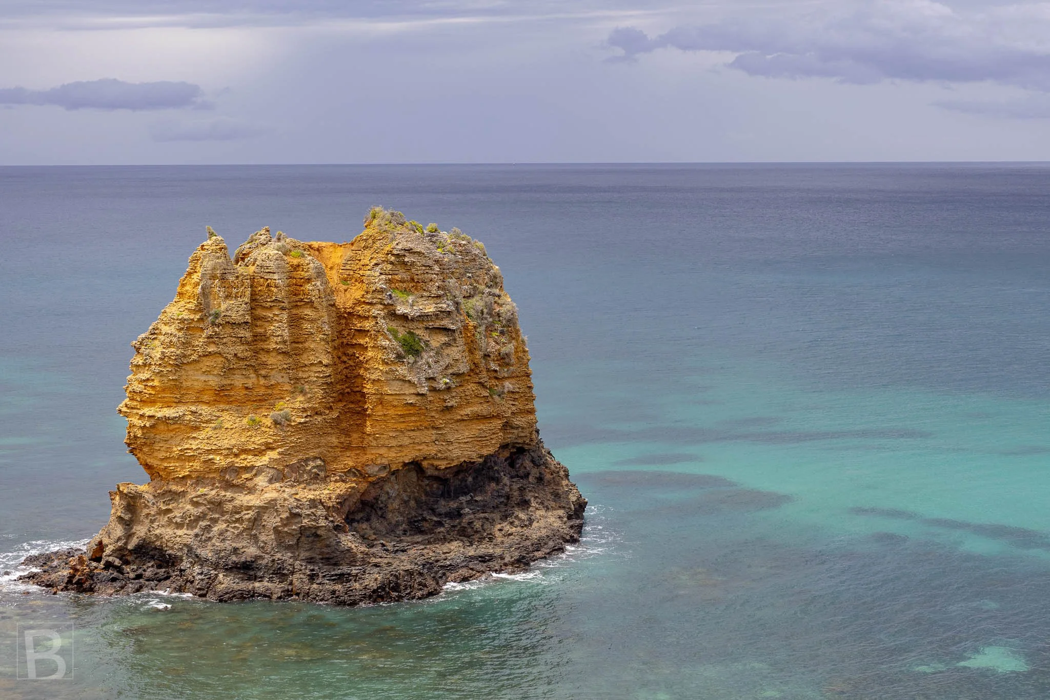 Eagle Rock stands apart from the coast, its weathered layers
revealing the persistent shaping force of the Southern Ocean.