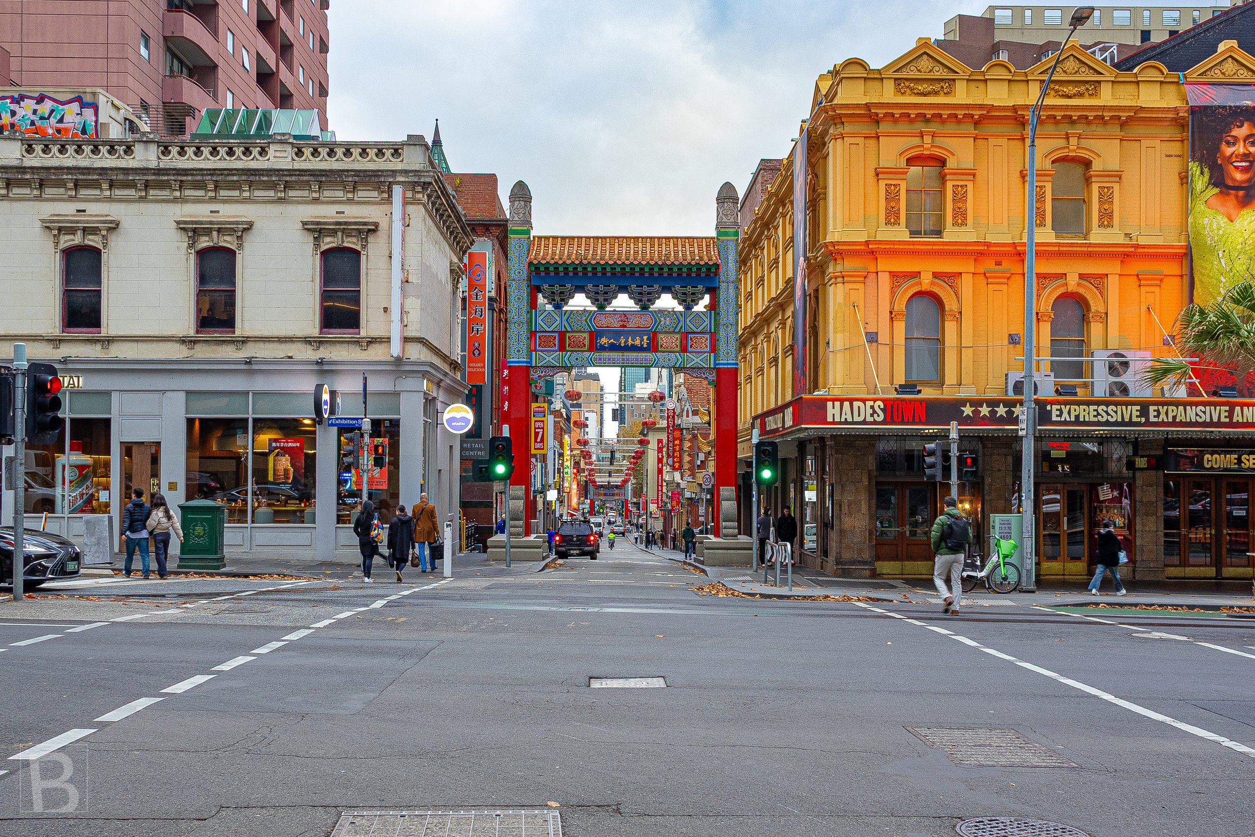 Historic facades, street signs and the Chinatown arch create a
layered urban scene shaped by commerce, culture and colour.