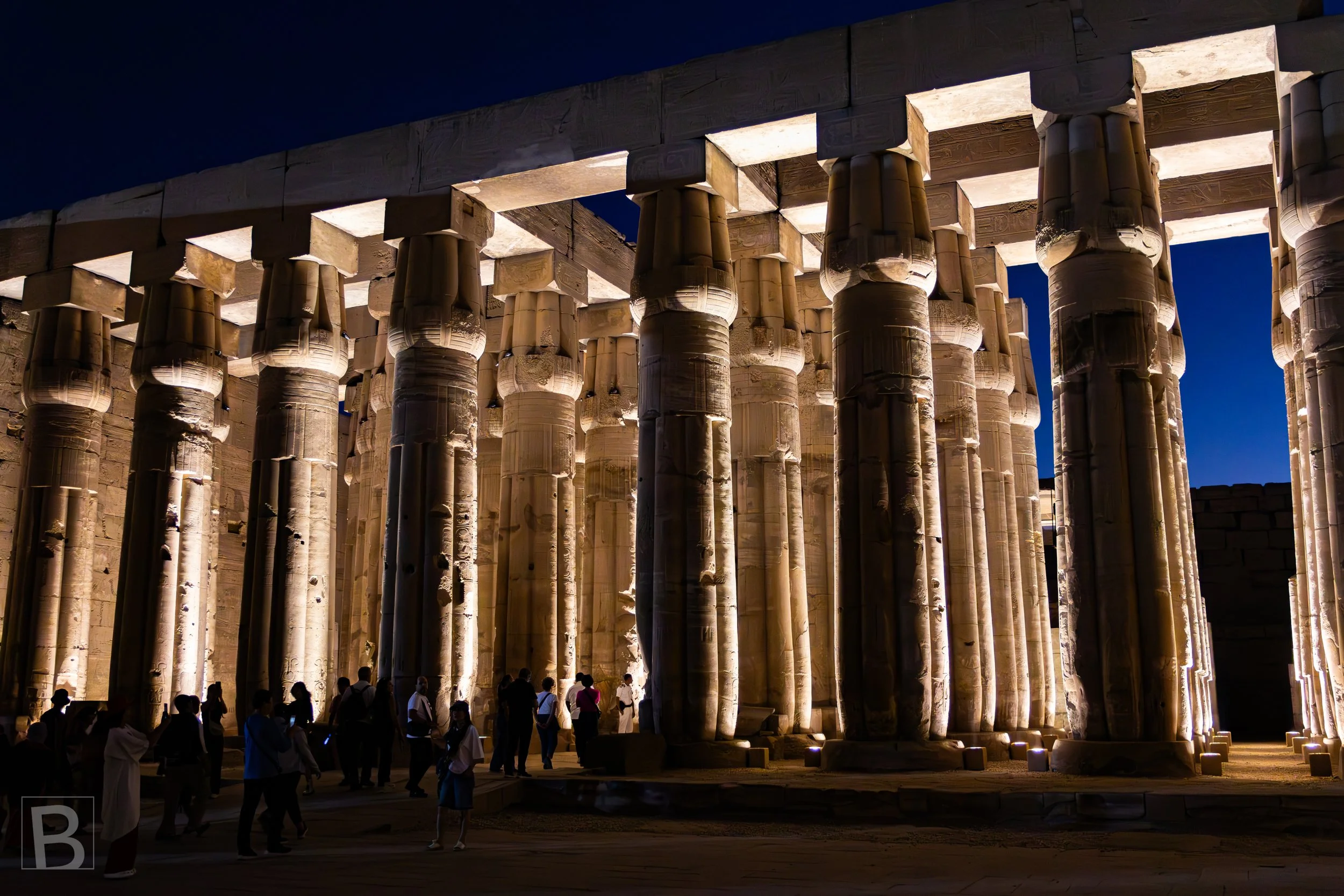 Warm light defines the immense hypostyle structure and its forest of
carved stone supports after sunset.