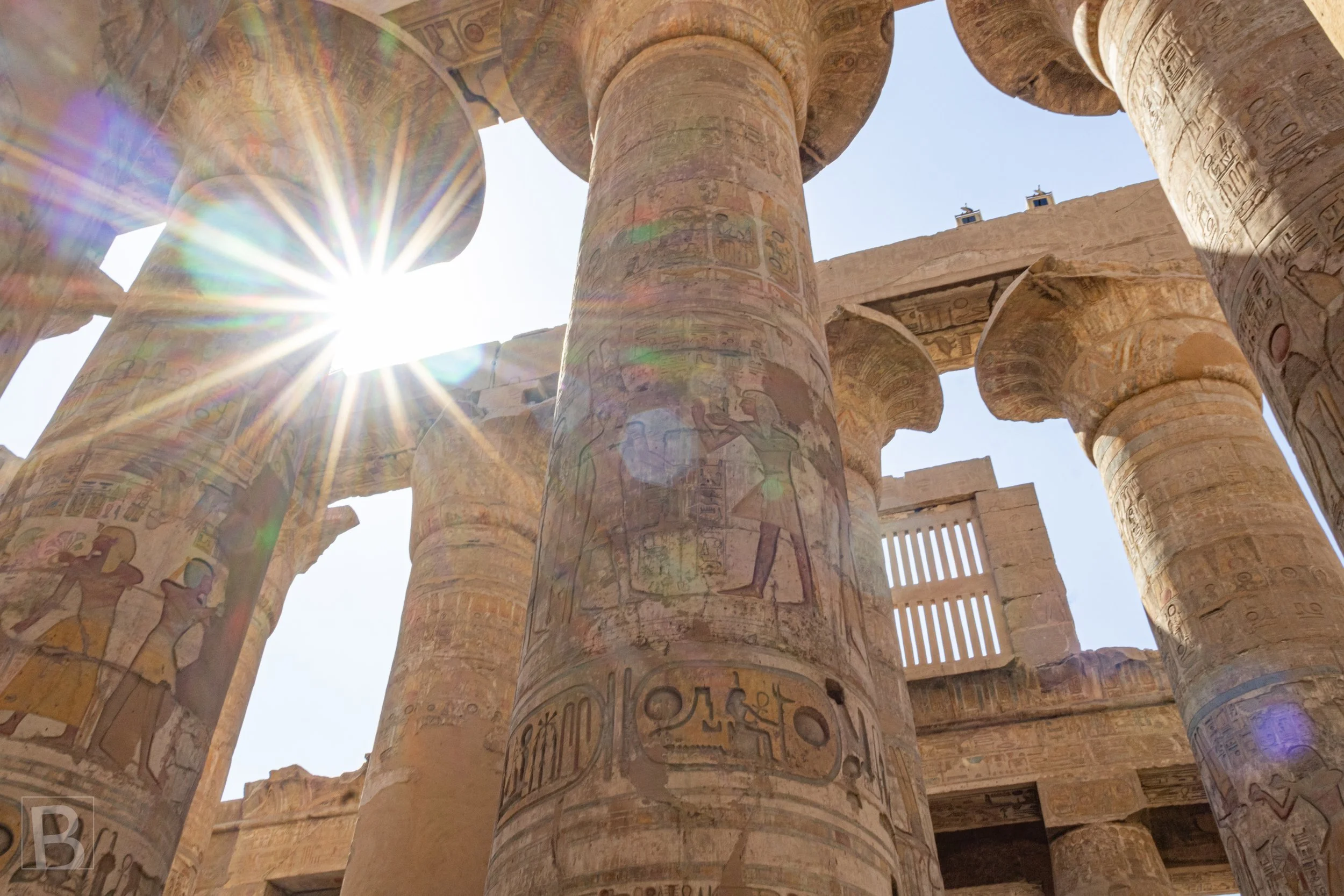 The ancient colonnade becomes a dramatic meeting of shadow,
hieroglyphs and intense desert light.
