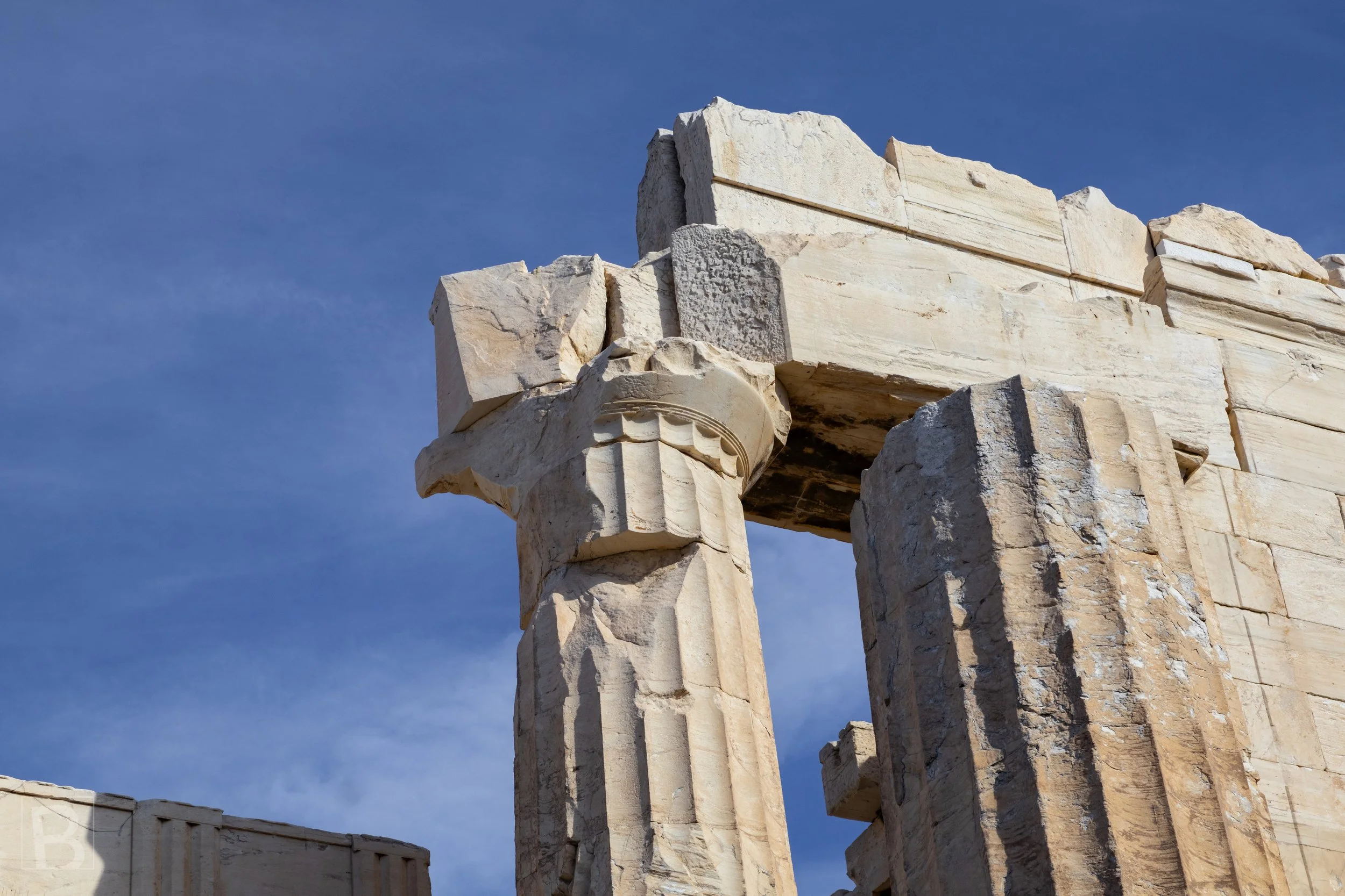 Weathered marble, fluting and fractured edges reveal the enduring
weight and craftsmanship of classical Greek construction.