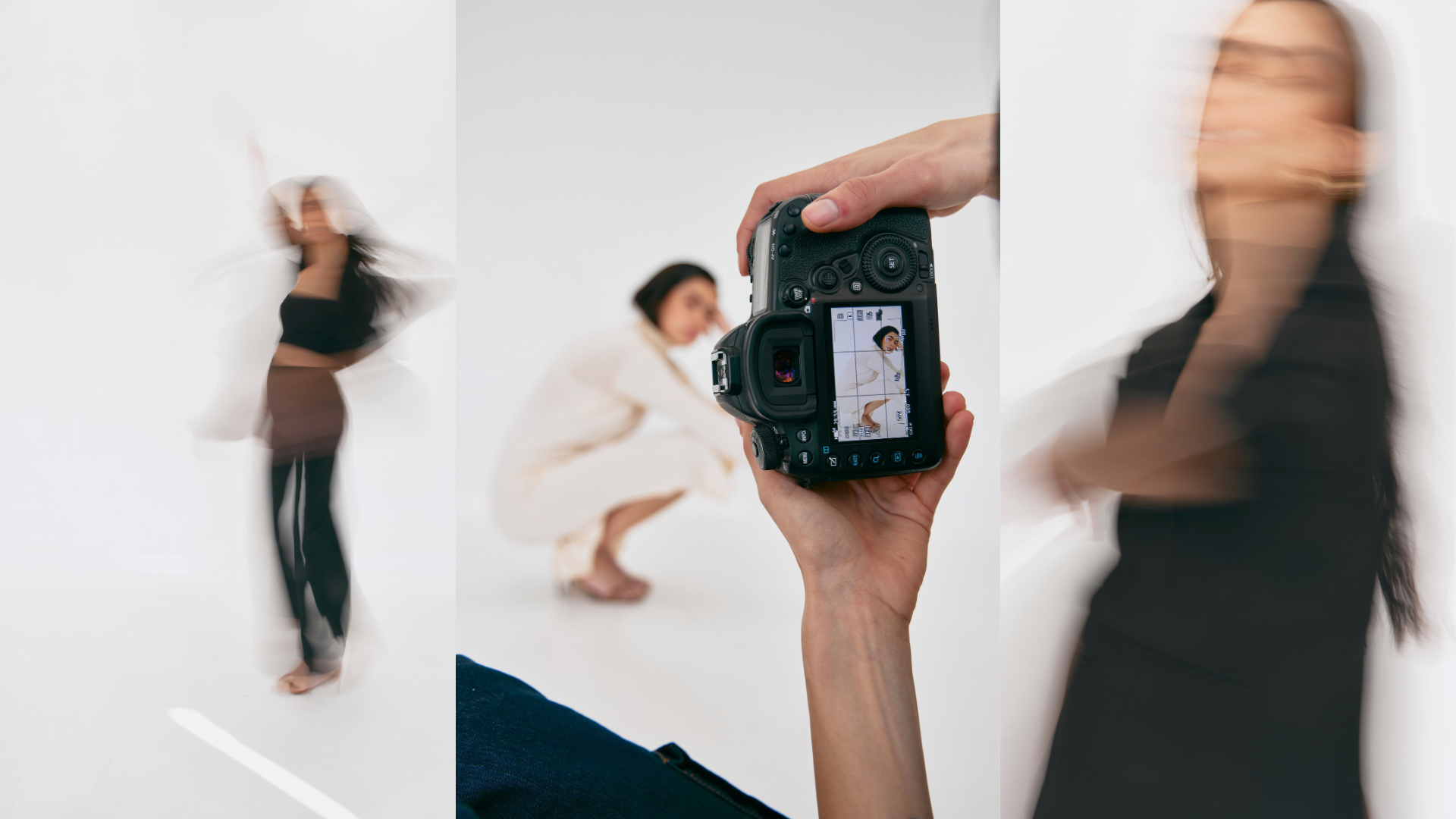 A woman in a black outfit appears to be moving or dancing in front of a white background while two other women, one squatting in beige and the other stretching in black, are blurred. A hand is holding a camera, capturing the scene.