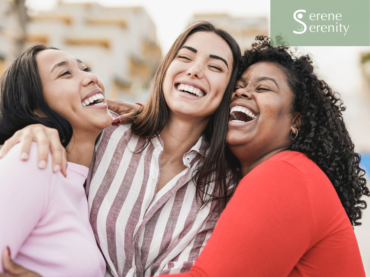 Three women having a joyful hug outdoors, smiling and laughing. womens health and menstrual support