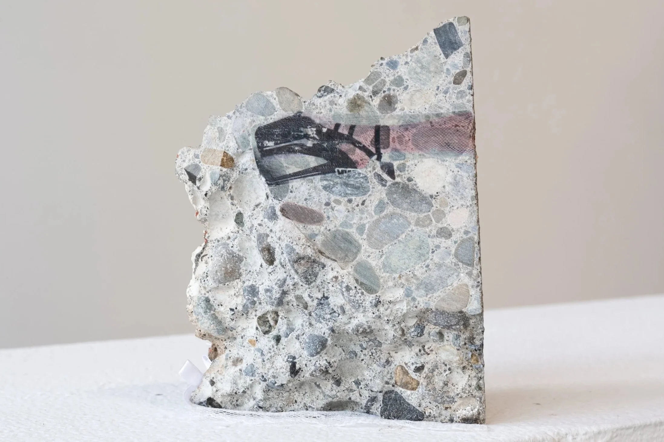 chunk 222, 2026
materials: exotic magazine image transfer and salvaged concrete chunk 
4.5" x 2" x 6