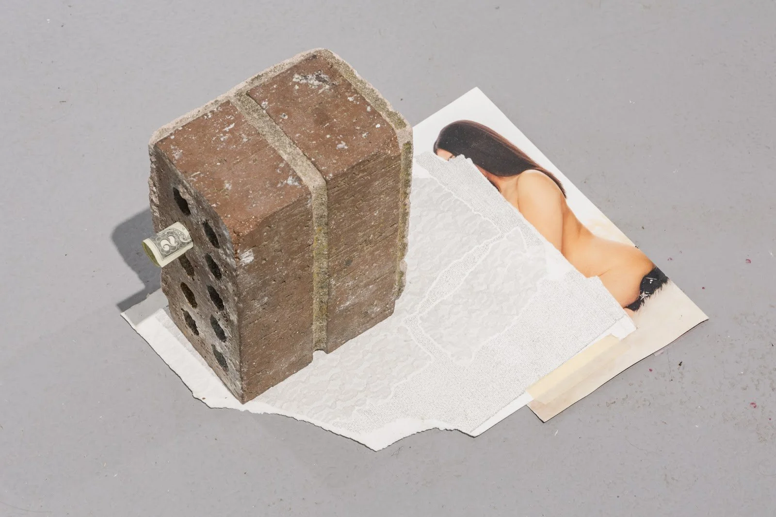 BrickPrint1, 2022
Materials: Brick fragment, silicone caulk, monotype print, masking tape, Exotic magazine image, 2 dollar bill