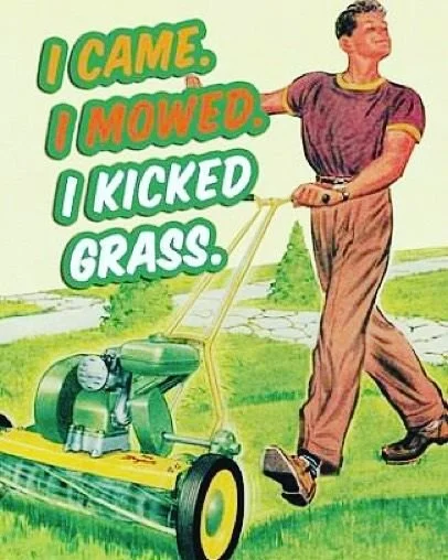 A woman in casual clothes is pulling a lawn mower across a grassy yard, with a background of greenery and trees. The text on the image reads, 'I came. I mowed. I kicked grass.'