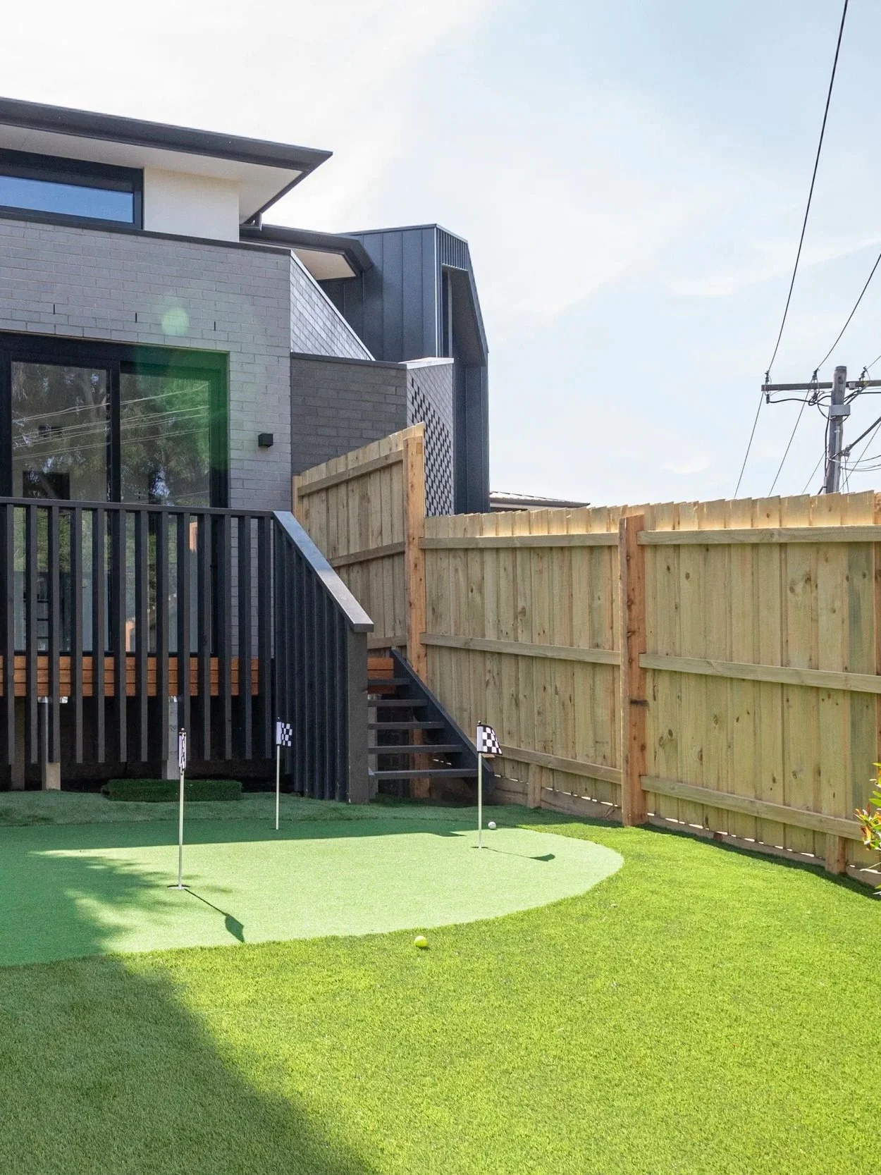 The innovative mini golf field at the back of the house, bring fun and innovation to backyard garden design.