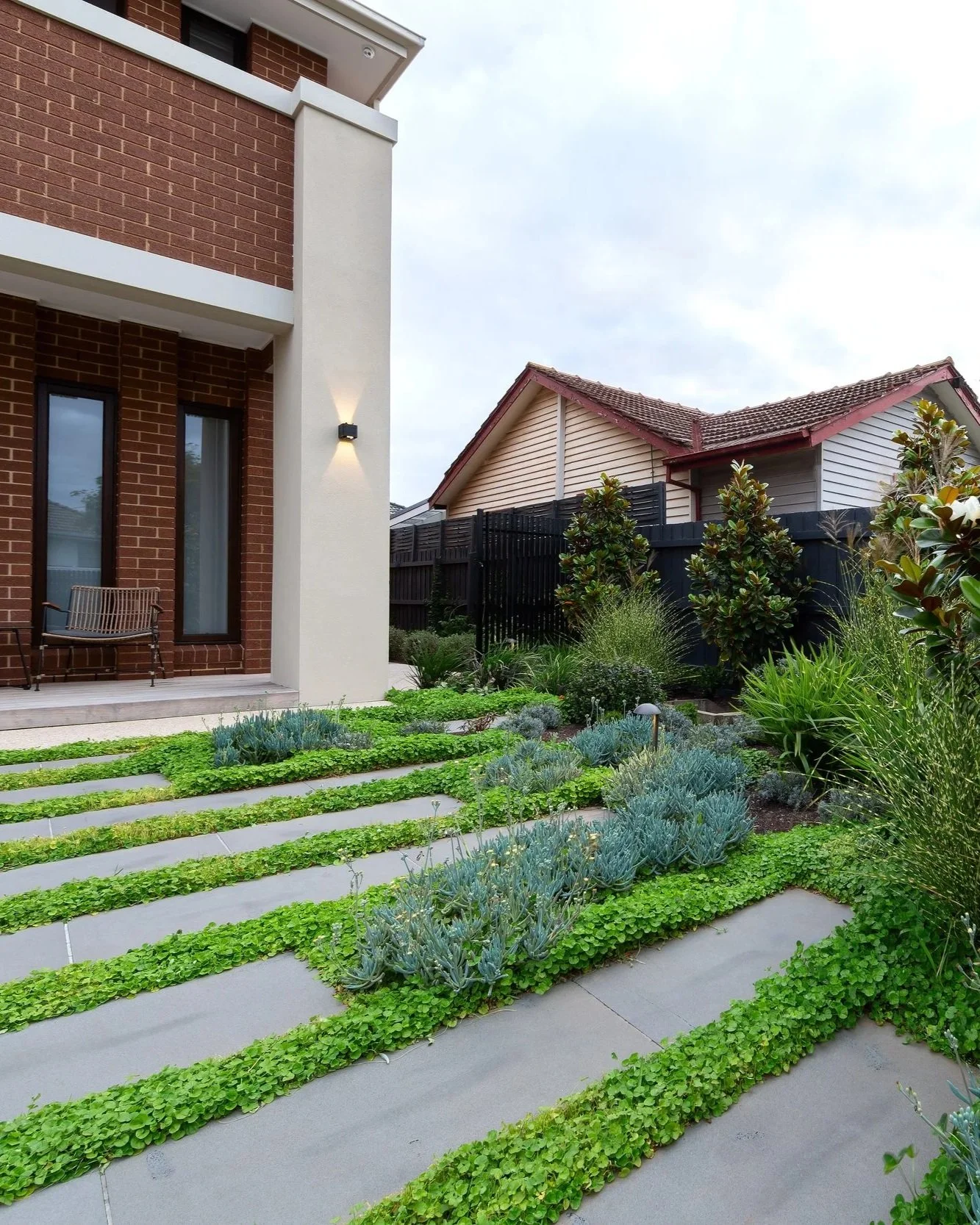 Lush garden vegetation in Bentleigh East, a landscape medium garden design and construction with stepping stones.