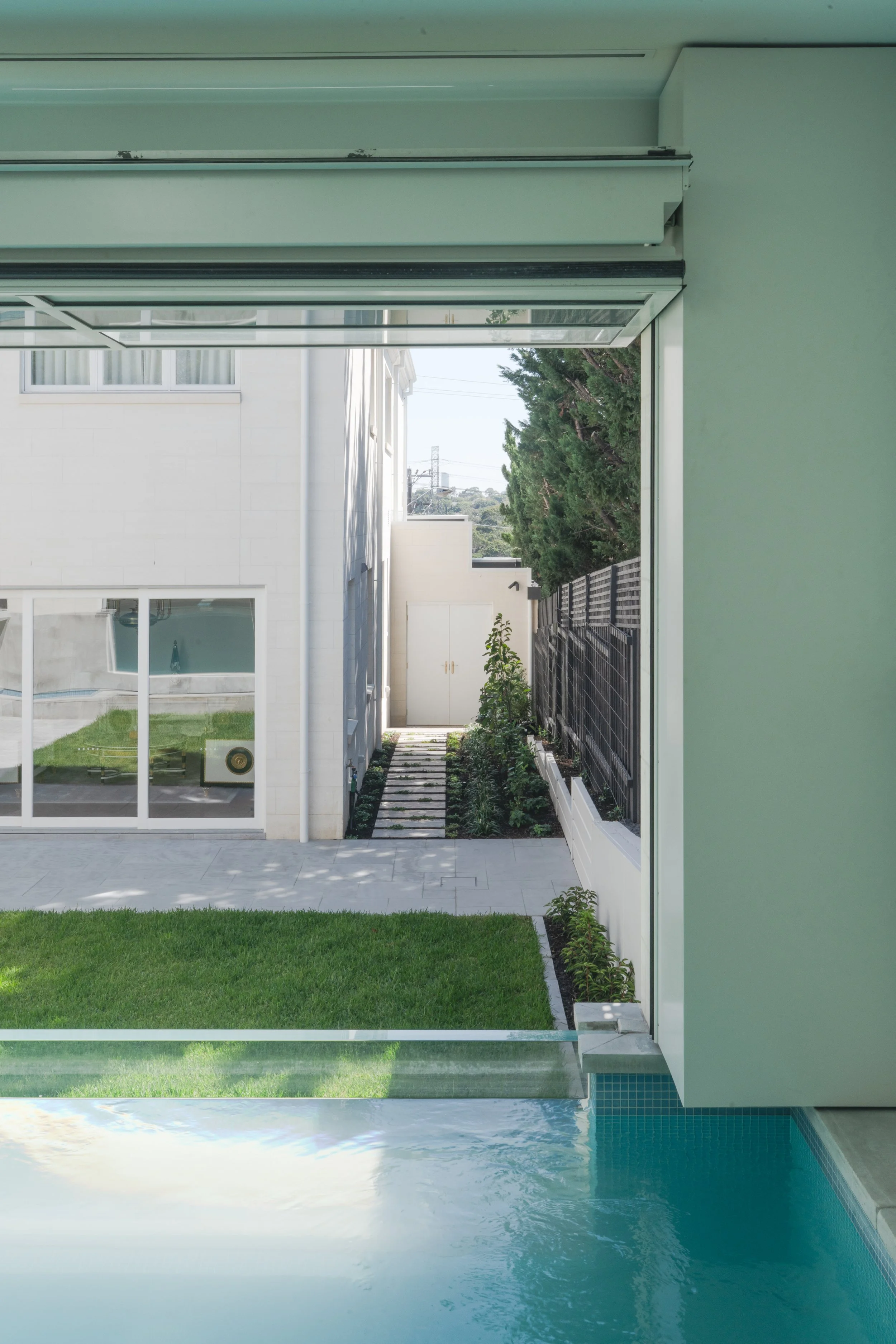 The opening of the indoor pool house able people to overlook the back lawn and sidewalk.