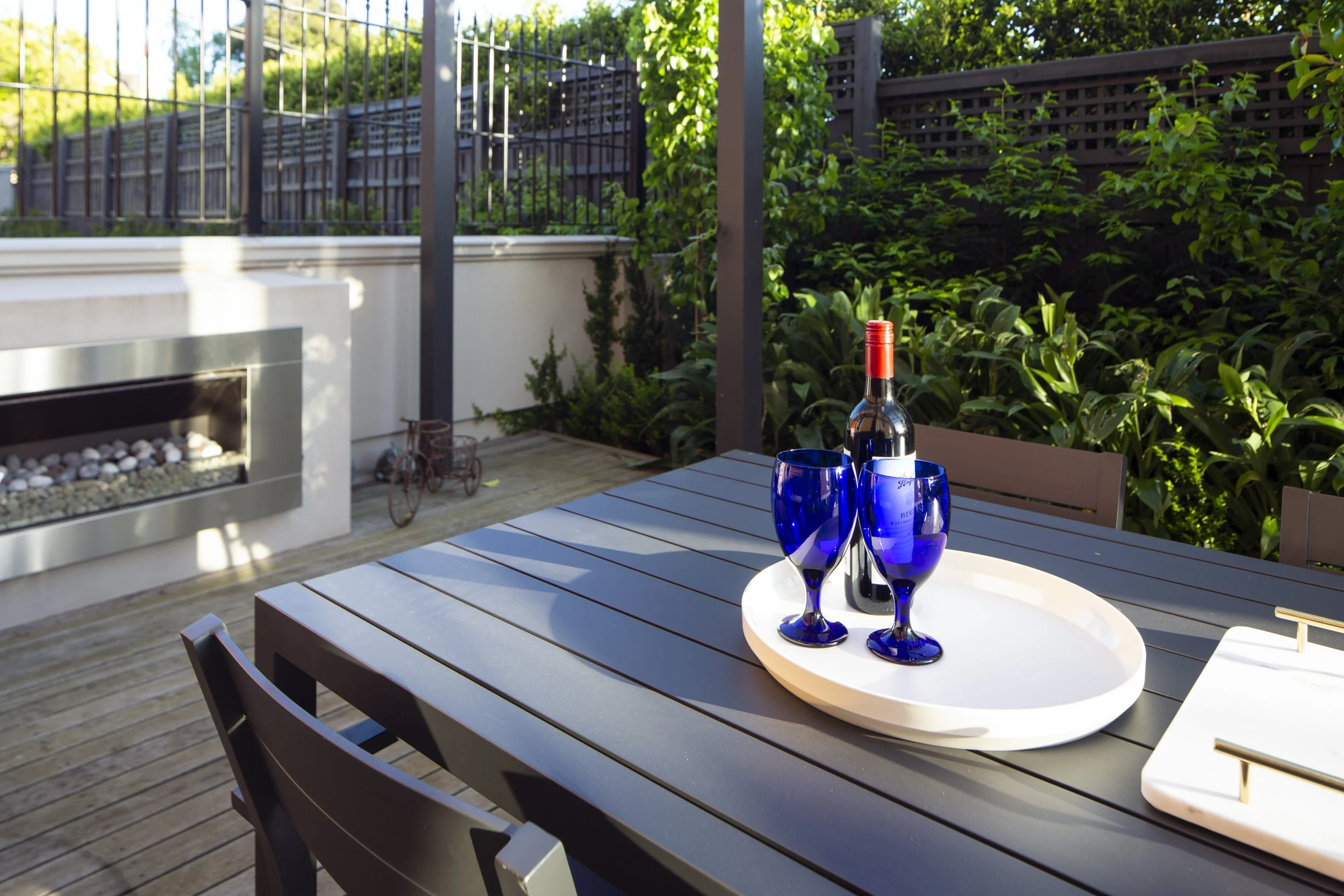 The timber decking with dark charcoal steel columns, showing a good quality of life.