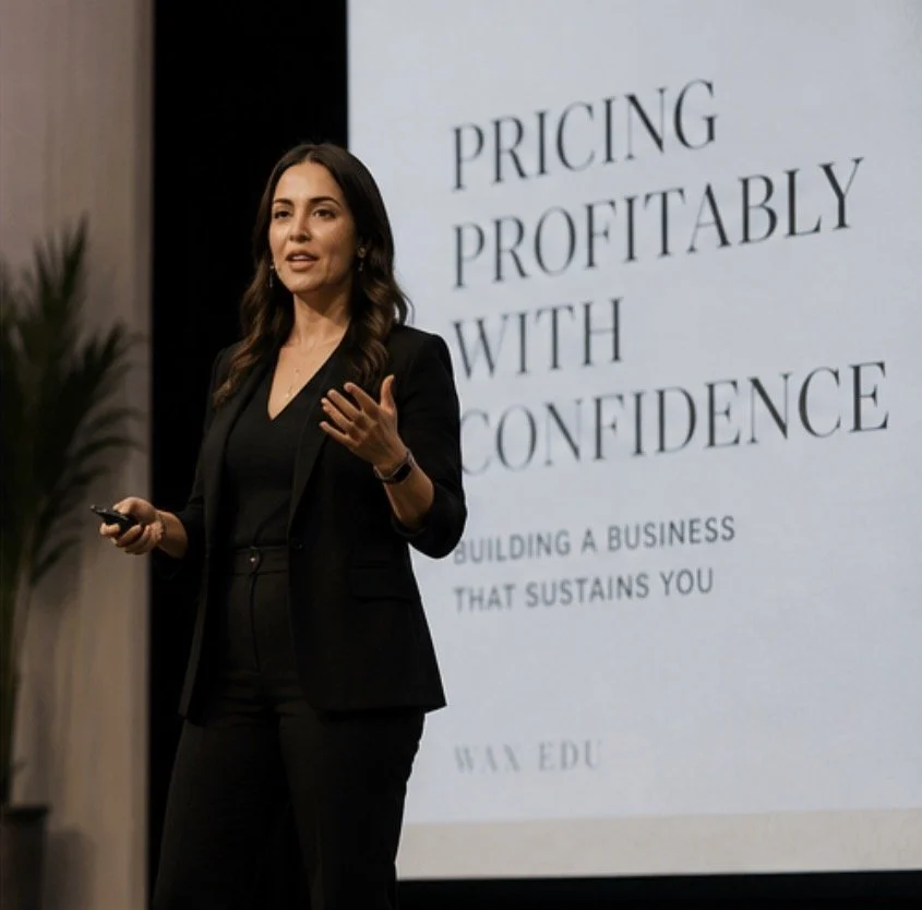 Business education session at WAX EDU featuring an industry expert teaching pricing, profitability, and business growth for estheticians and waxing professionals.