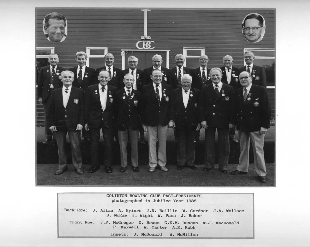 Black and white group photo of Clinton Bowling Club past-presidents taken in Jubilee Year 1988. The group comprises 15 men dressed in formal blazers and ties, standing and sitting in front of a building with two large photos of men's faces at the top