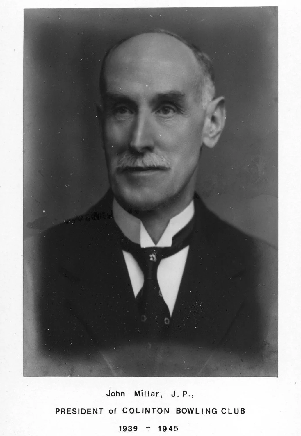 Black and white portrait of John Millar, president of the Chelton Bowling Club from 1939 to 1945, dressed in formal attire with a bow tie.