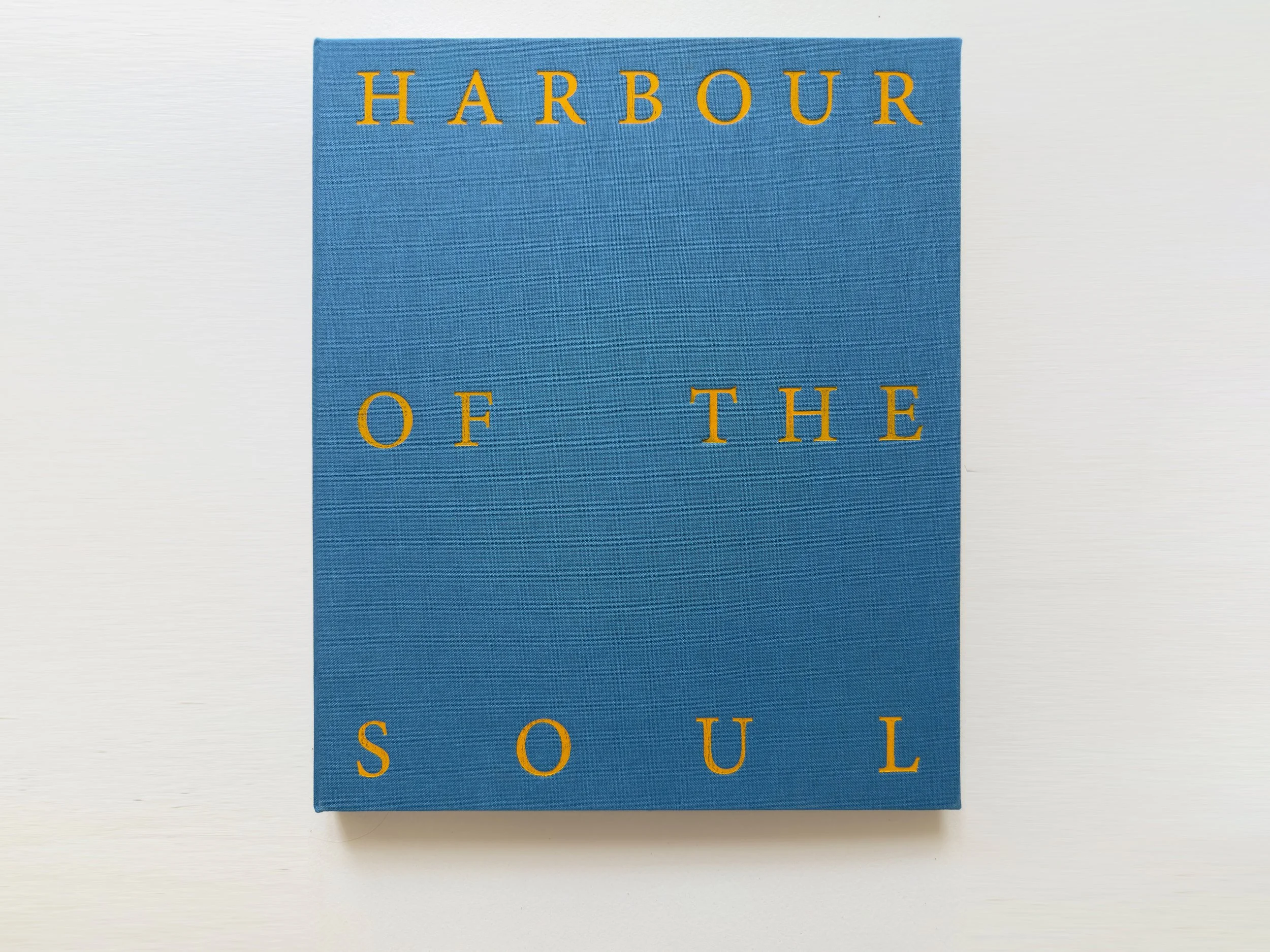 Harbour of the Soul. The front cover, blue Van Heek cloth with the title in gold foil.