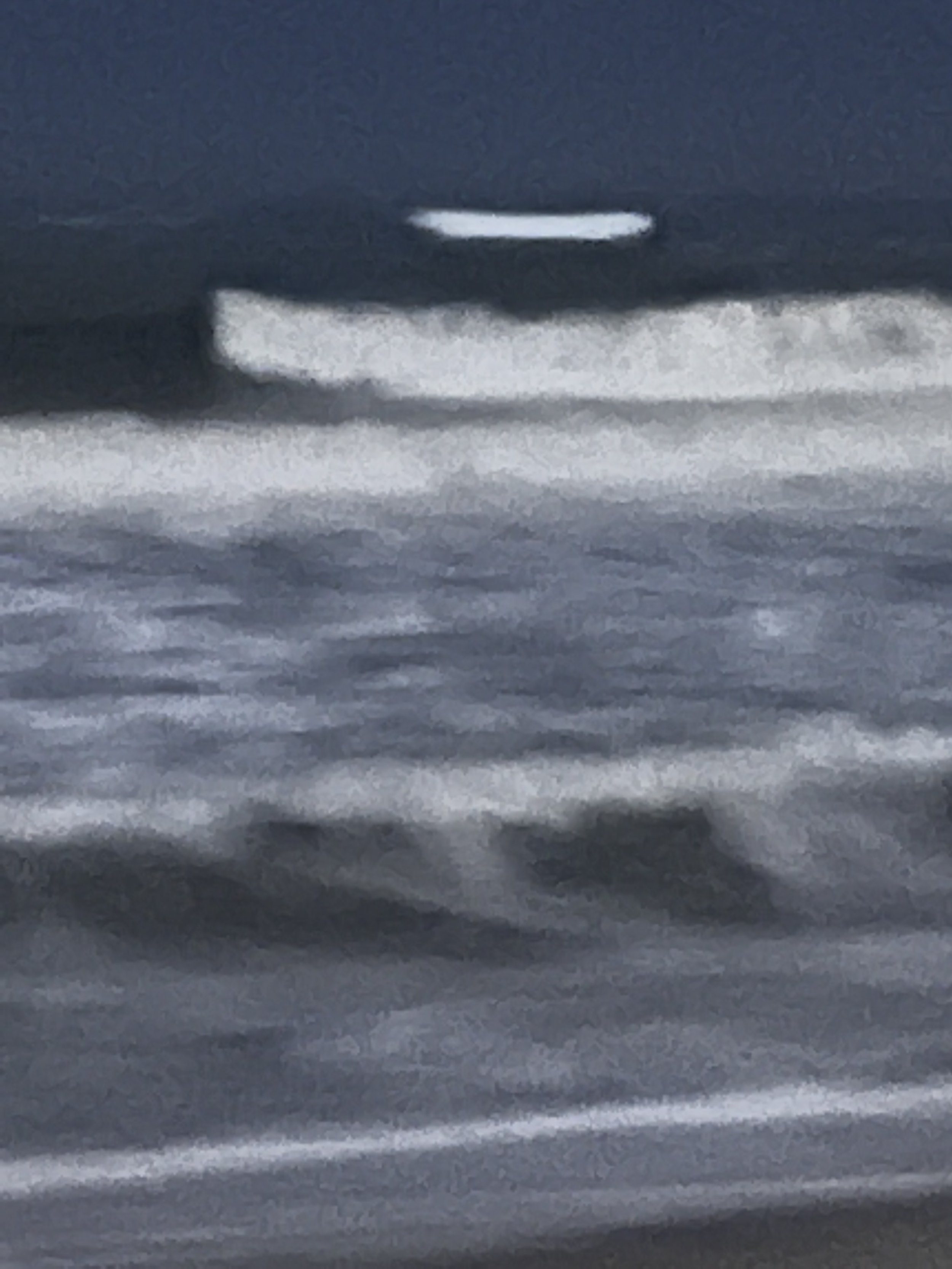 At the Edge of Light, Fire Island. A single bright break in the wave line under a dark blue sky.