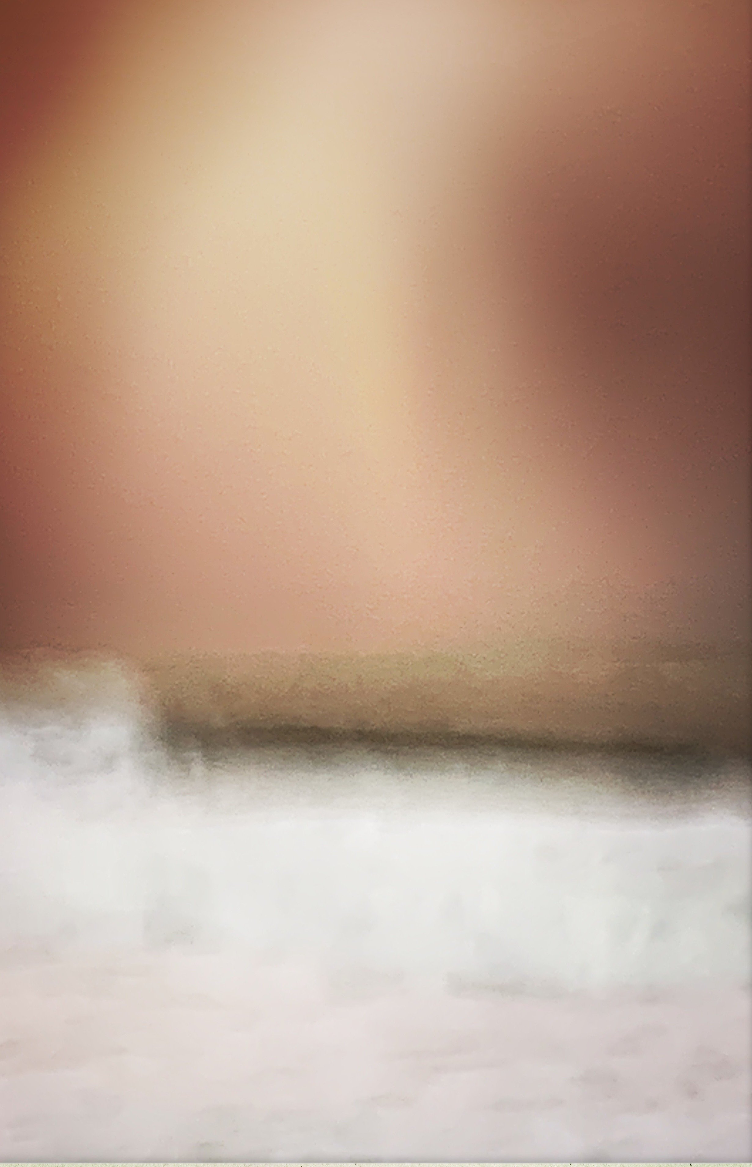 Blurred abstract background with warm tones and indistinct shapes.