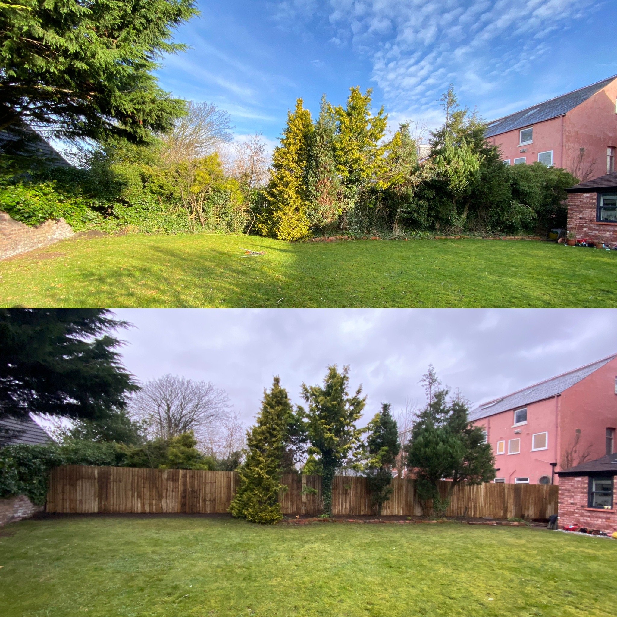 A backyard with green grass, several trees, a wooden fence, and a pink two-story house with a gray roof, under a partly cloudy sky.