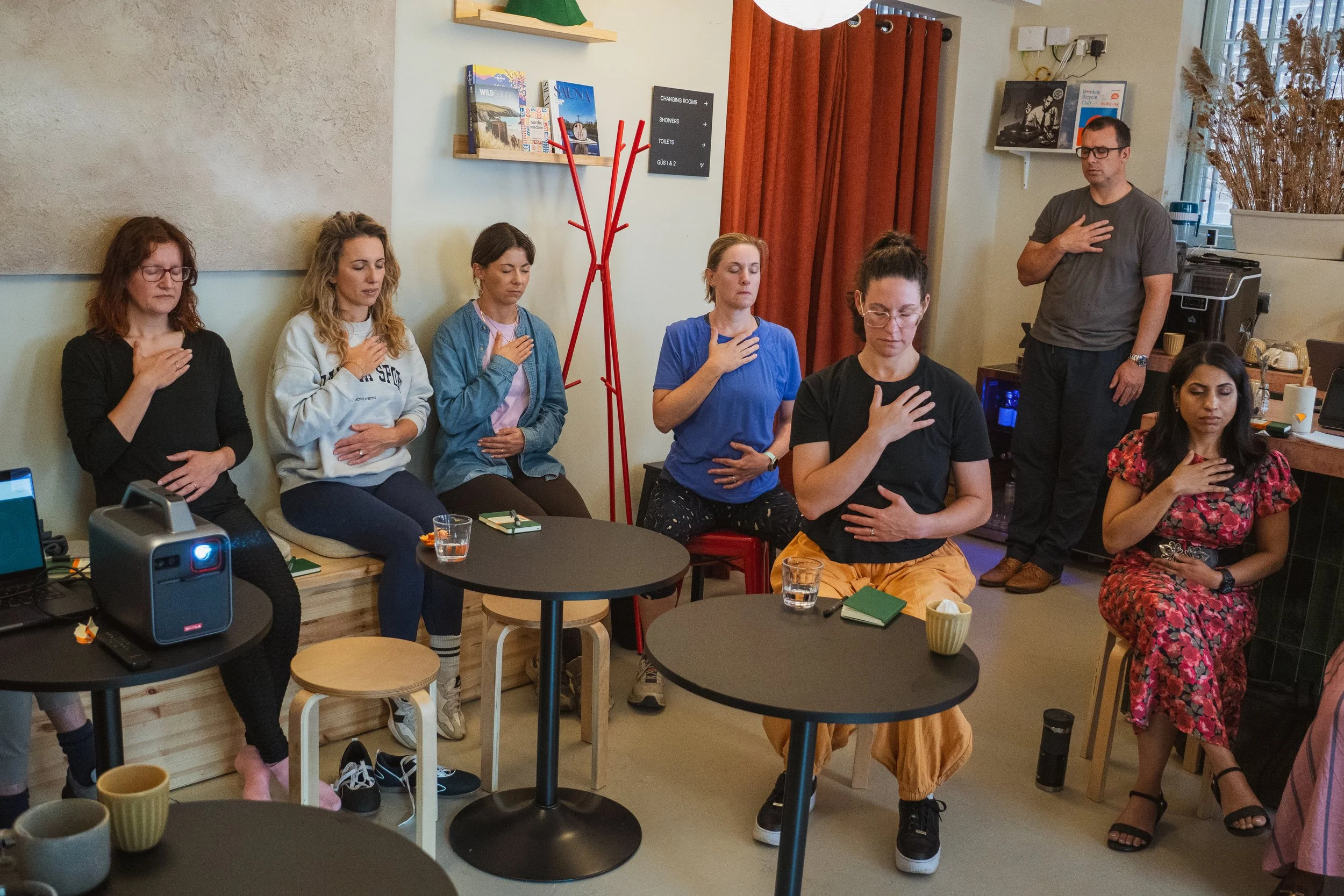 Participants practising guided breathing at Foundations of Balance