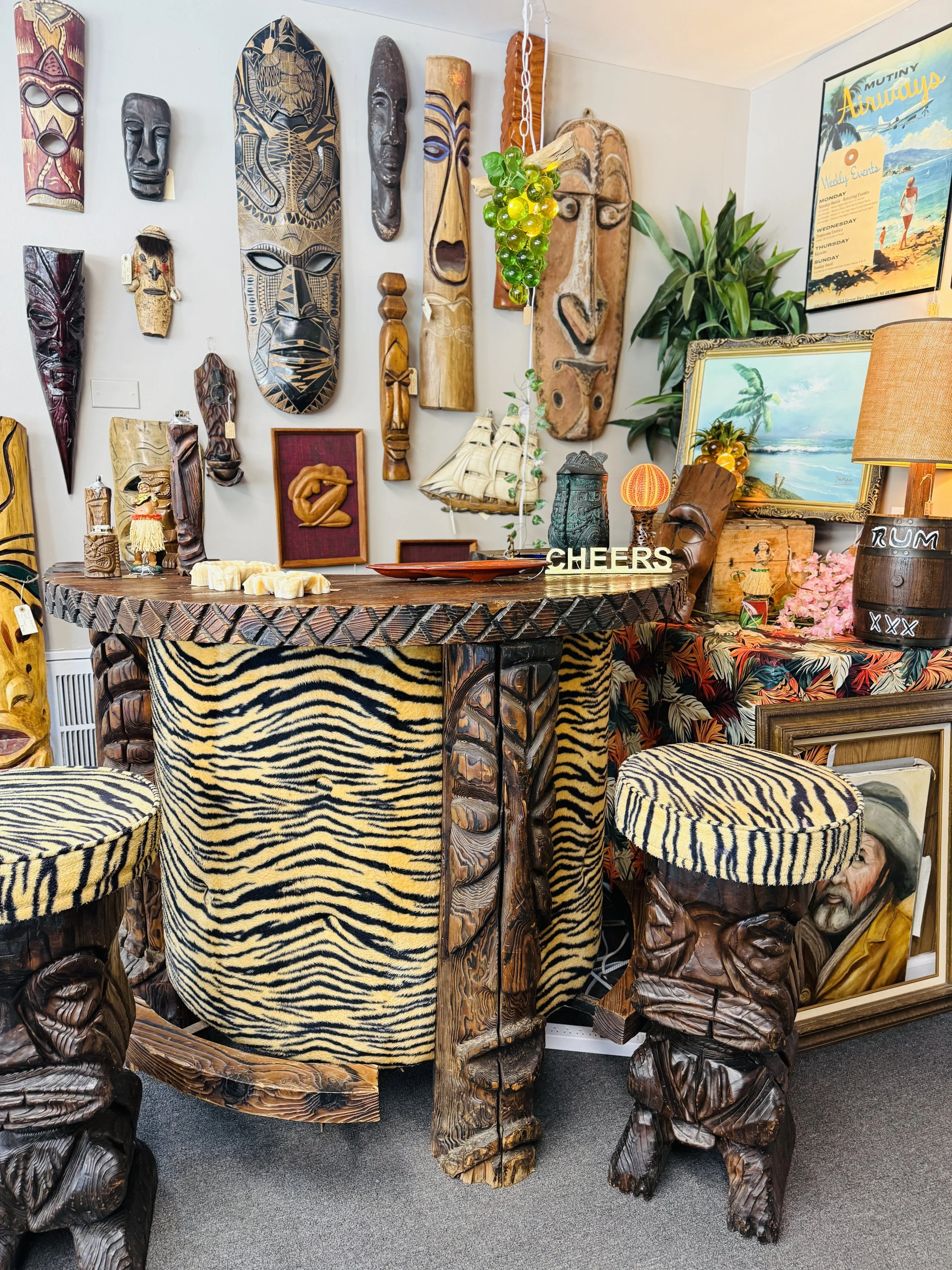 Vintage tiki bar with vintage tiki decor and barware.