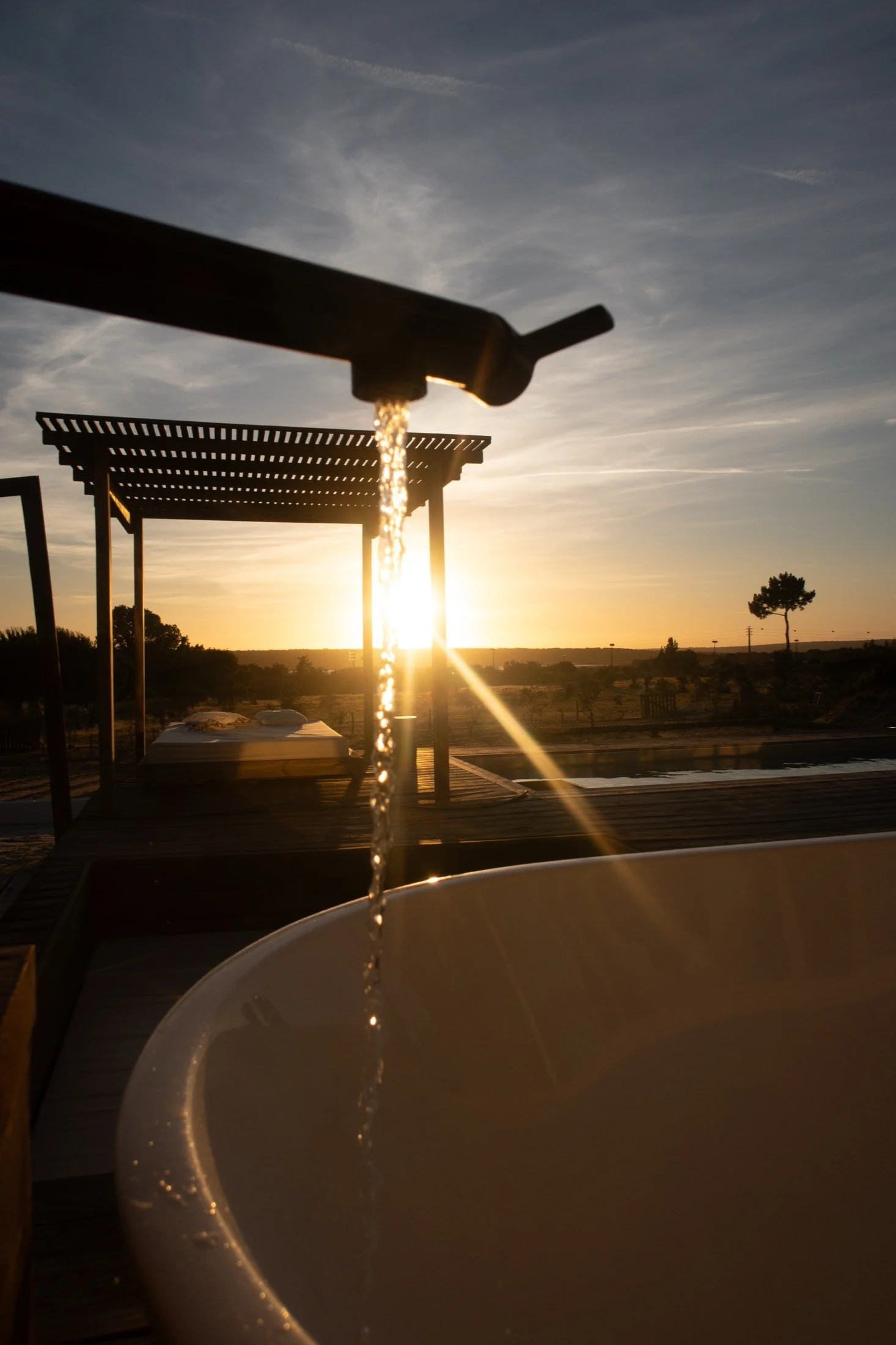 Filling the hot tub at sunset