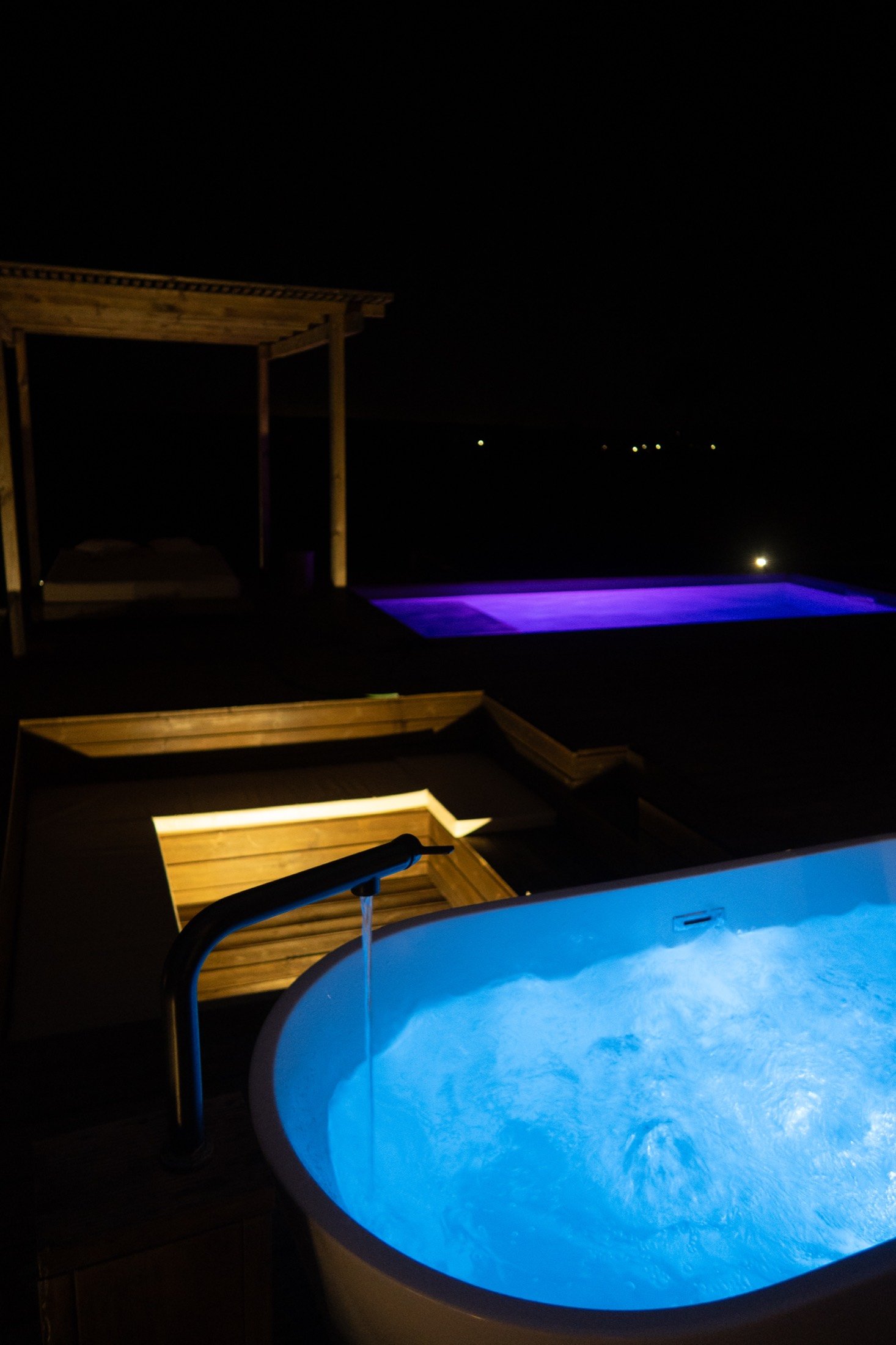 Pool and hot tub at night