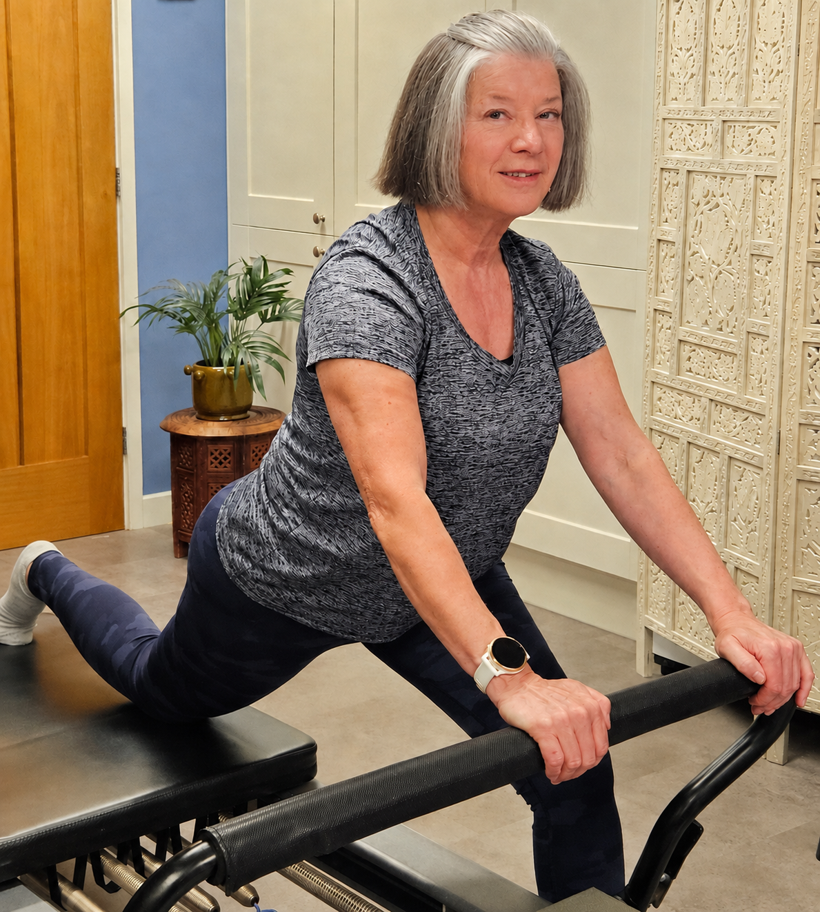 Jenny Dudfield demonstrating an exercise on the Pilates Reformer