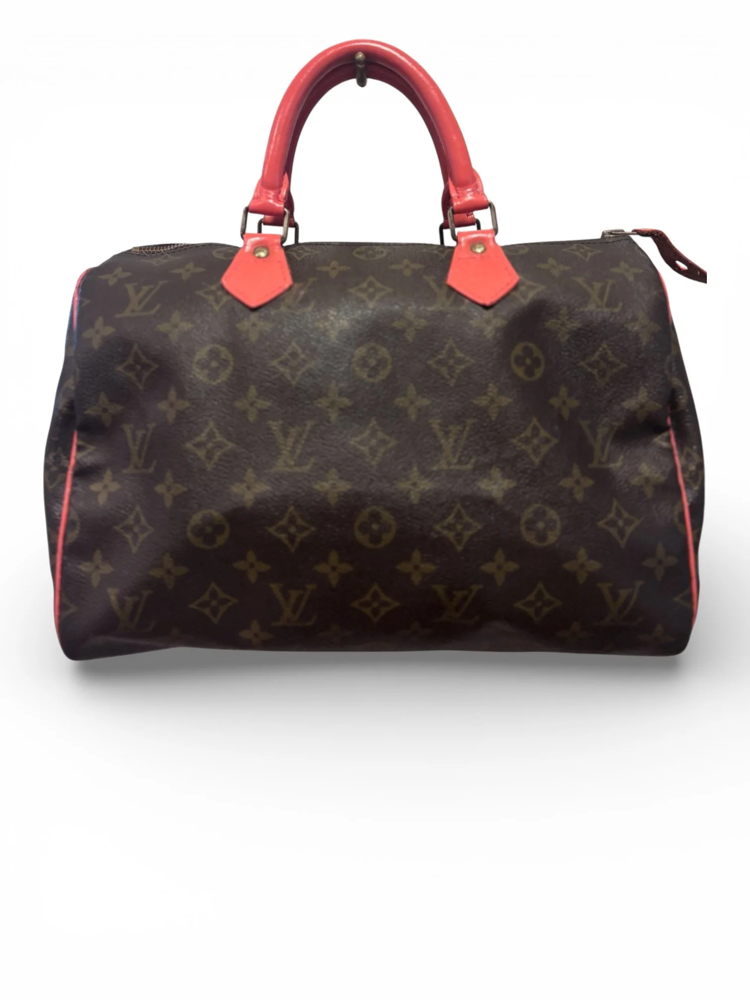 A Louis Vuitton Keepall duffel bag with a brown monogram pattern and red leather handles, placed against a white background.