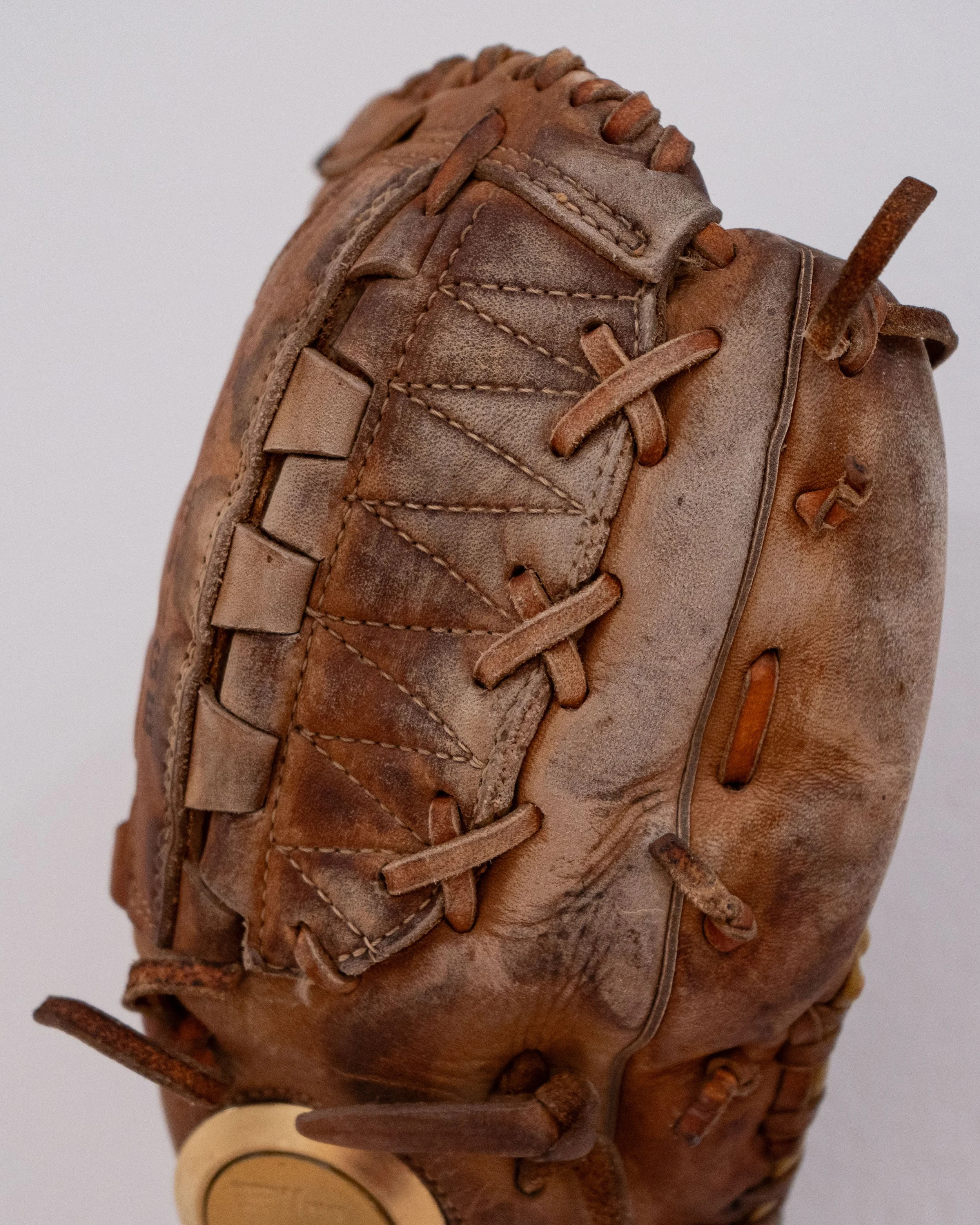   Untitled (Catfish Hunter) —   Leather, partial deadbolt lock, pine rosin
 
Image courtesy of Priya Vaswani