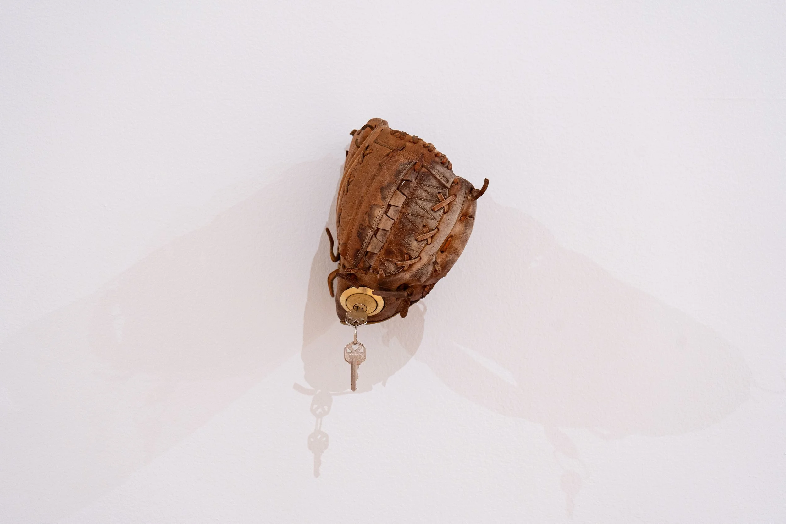  Untitled (Catfish Hunter) —   Leather, partial deadbolt lock, pine rosin
 
Image courtesy of Priya Vaswani