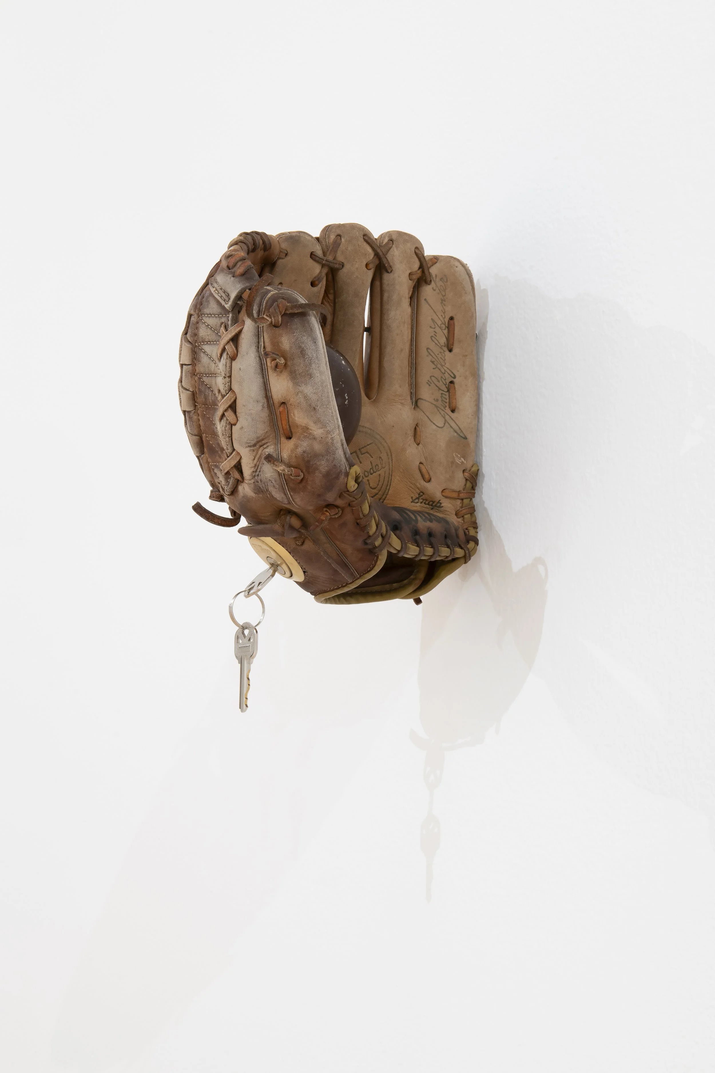   Untitled (Catfish Hunter) —   Leather, partial deadbolt lock, pine rosin
 
Image courtesy of John Carlano