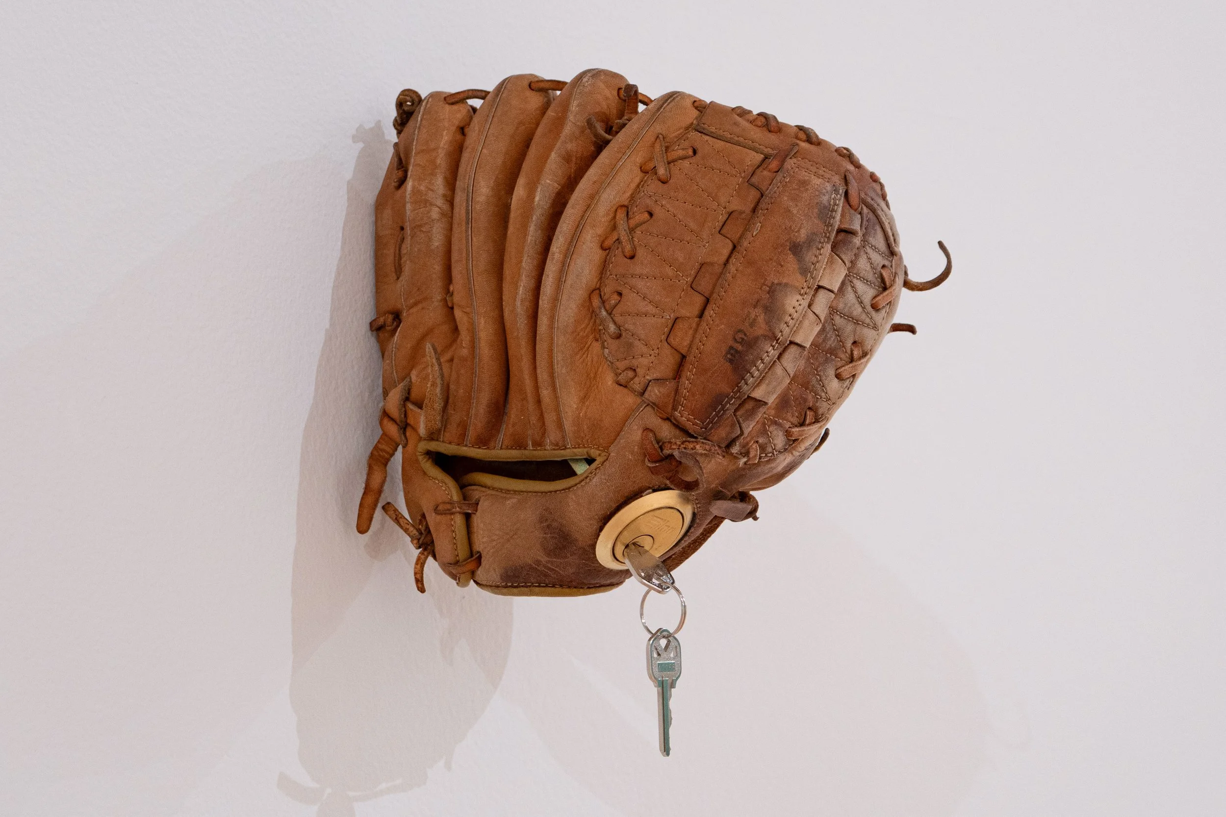   Untitled (Catfish Hunter) —   Leather, partial deadbolt lock, pine rosin
 
Image courtesy of Priya Vaswani