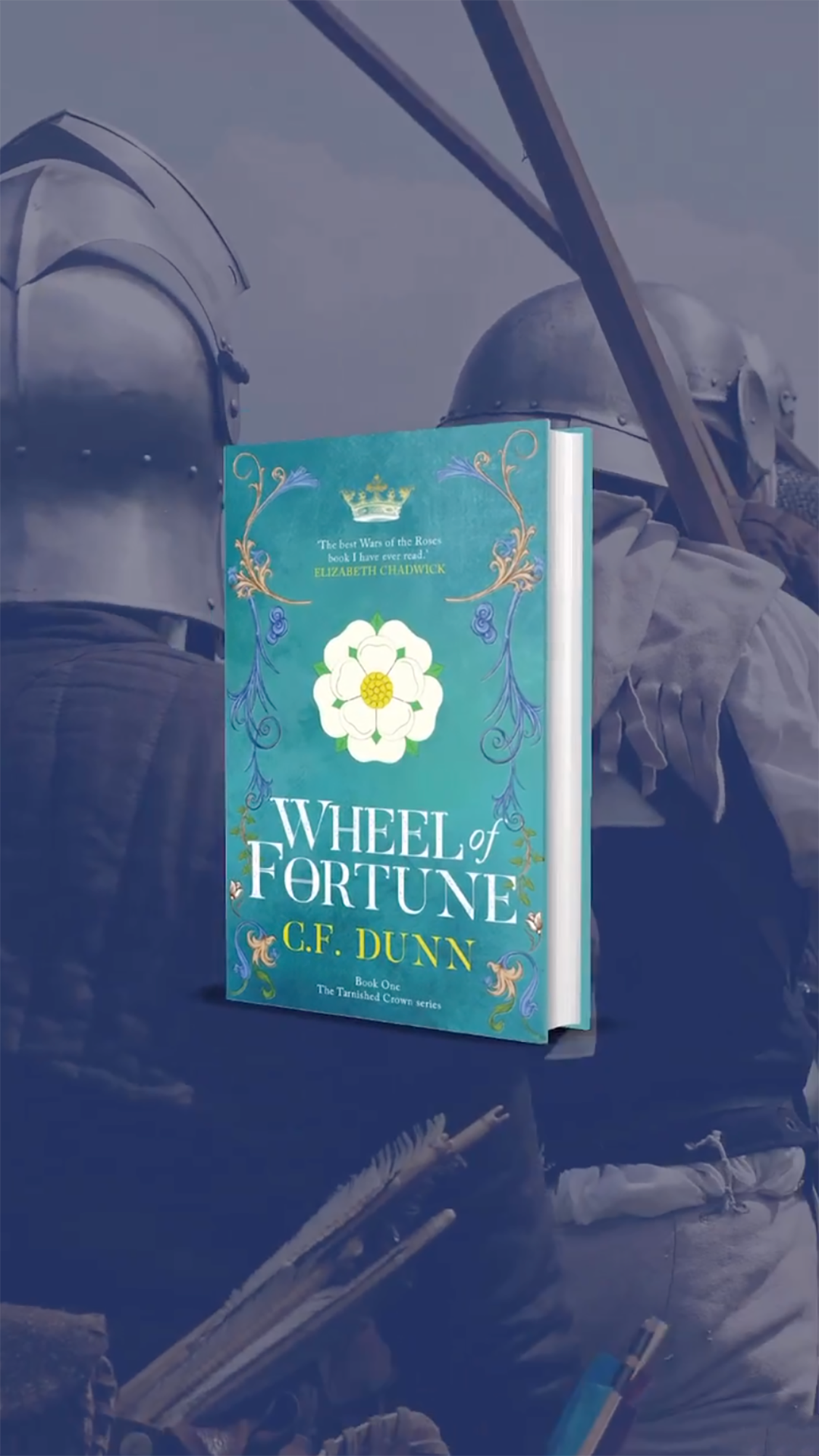 A hardcover book titled 'Wheel of Fortune' by C.F. Dunn, part of The Tarinsha Crown series, is held in front of a reflective surface, with knights in armor and a sword visible in the background.