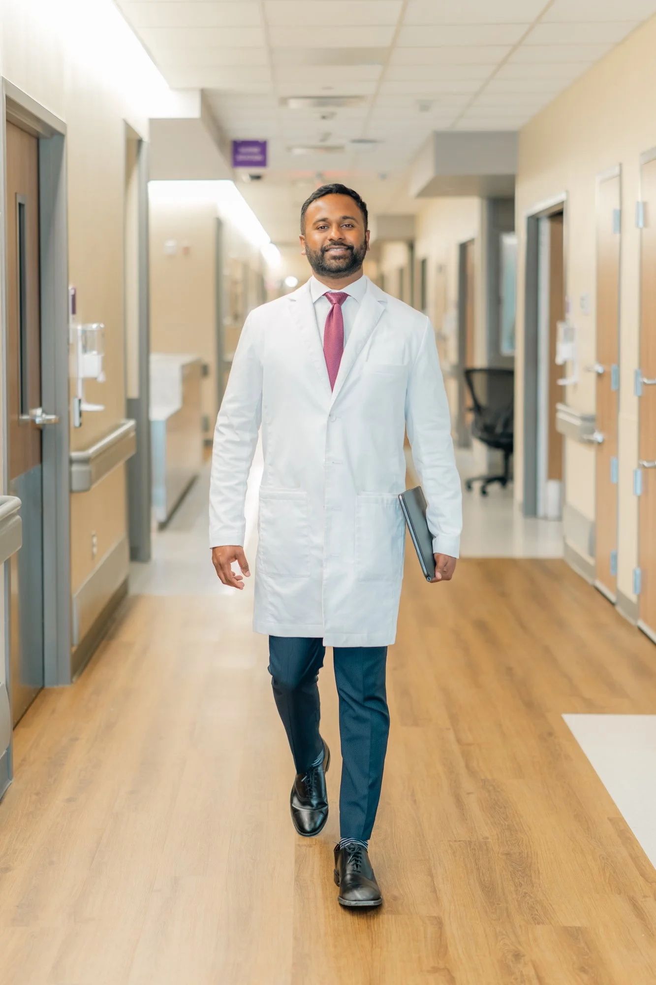 Walking through the surgical center, Gautham Prabhakar, a spine surgeon in San Antonio, Texas at Texas Neuro Spine