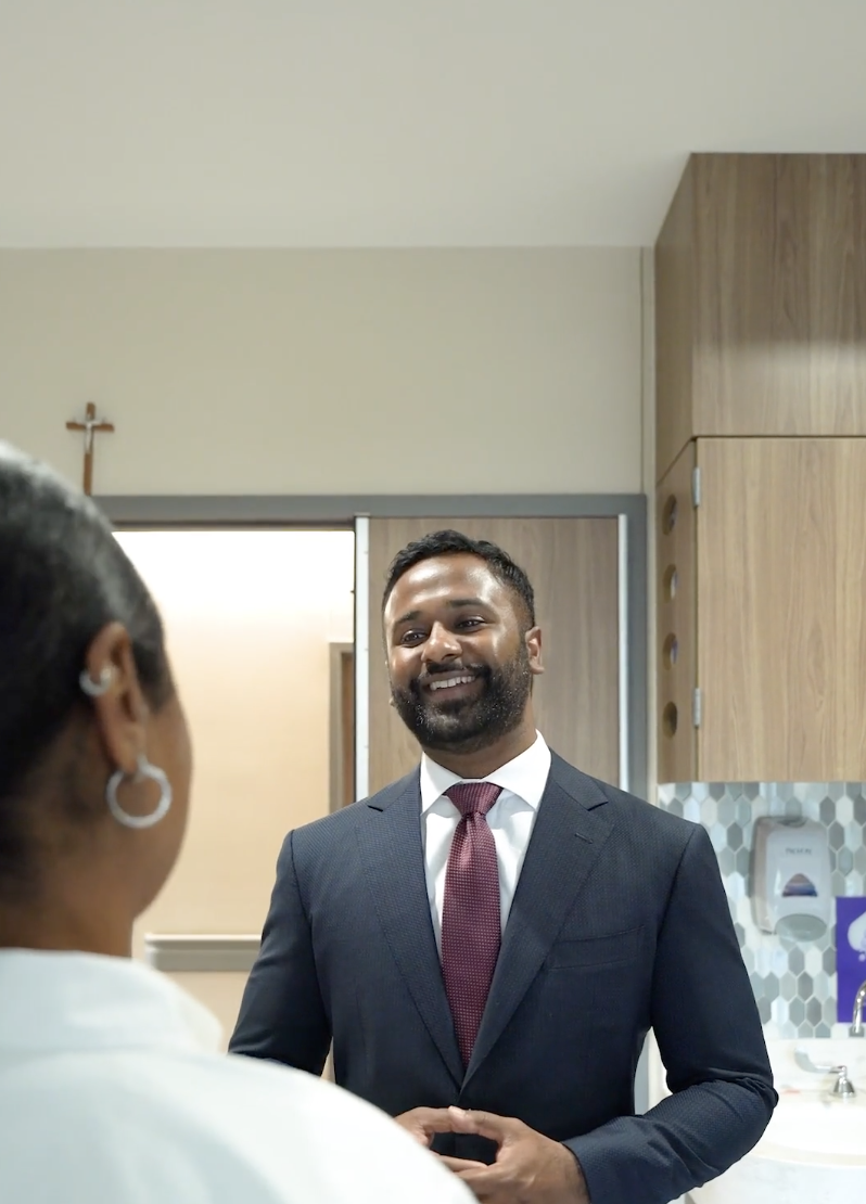 Discussing treatment options with a patient, Gautham Prabhakar, spine surgeon in San Antonio, Texas at Texas Neuro Spine
