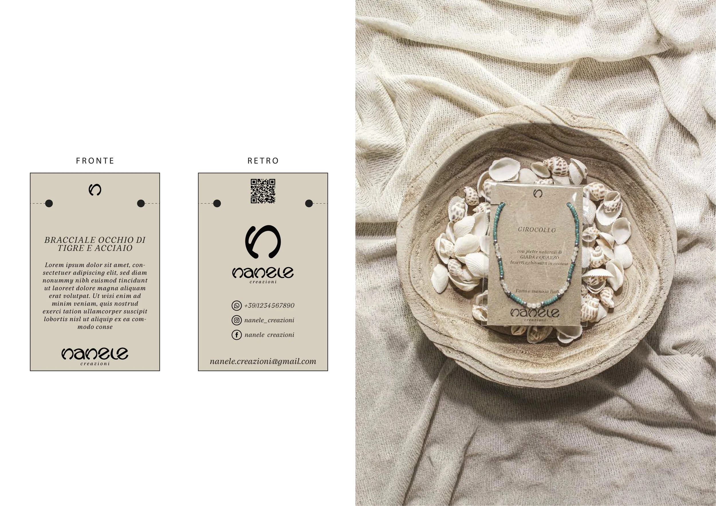 Business cards with contact information and a jewelry display with shells on a fabric background.