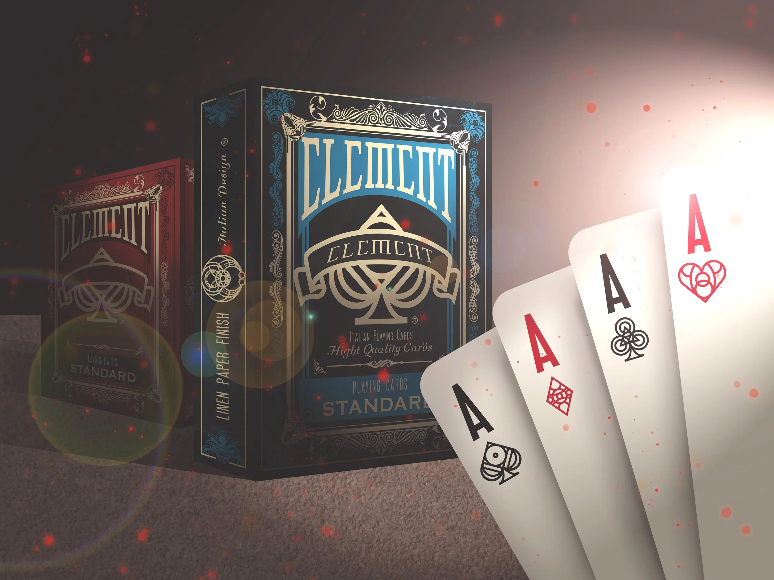 A deck of playing cards with a blue and black design and the word 'ELITE' on the box, along with three face-up cards showing the Ace of Hearts, Ace of Clubs, and Ace of Spades, spread out on a surface with multicolored specks.