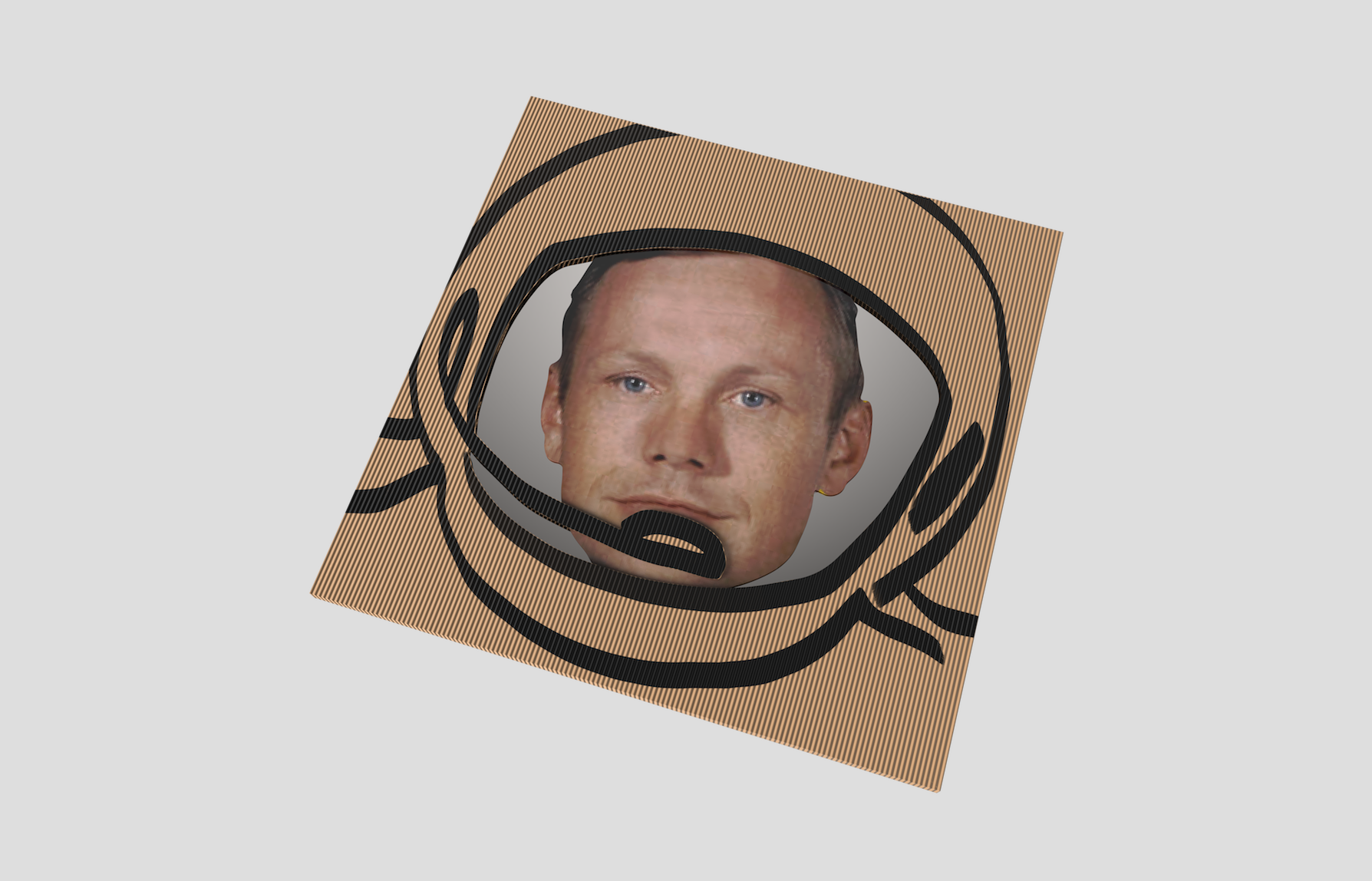 A cardboard box decorated with a drawing of an astronaut's helmet, with a superimposed cutout of a man's face inside the helmet opening.