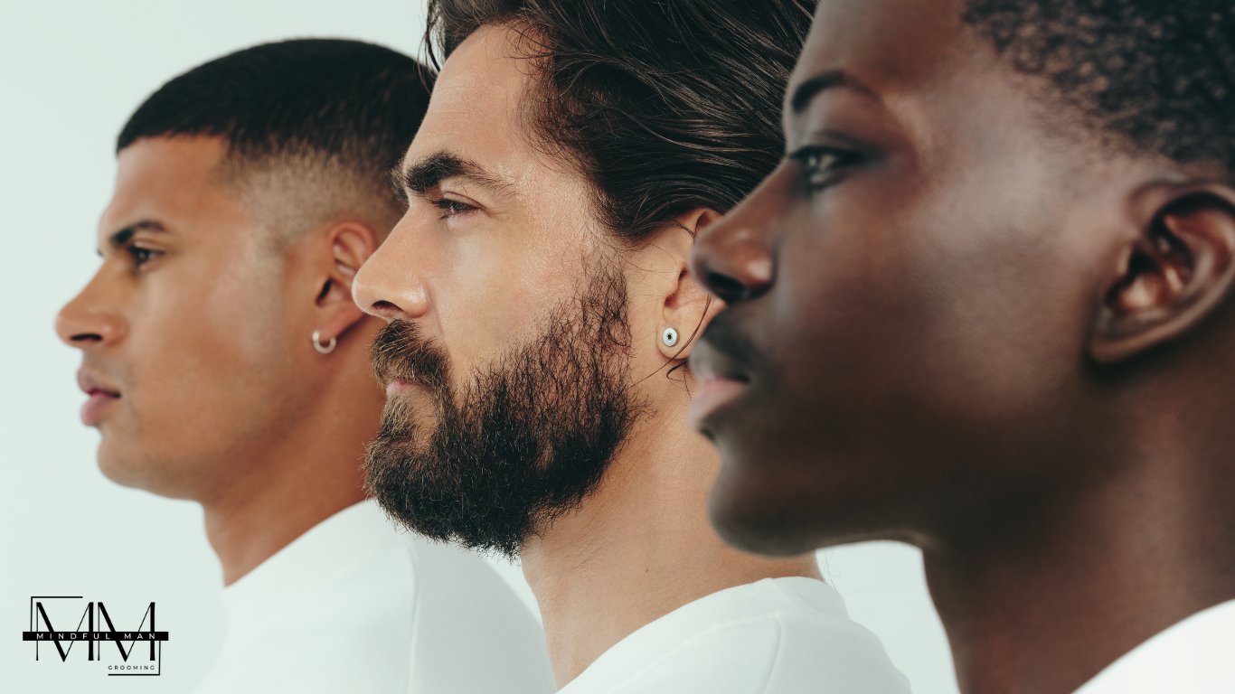 Close-up side profile of three men with diverse skin tones and hairstyles, facing to the right, against a plain white background, showcasing different grooming styles.