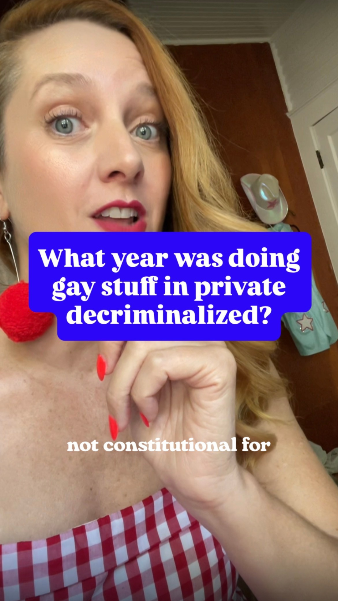 Close-up of a woman with red hair, wearing a red and white checkered outfit and red earrings, posing with her hand near her face. Overlaid text asks, 'What year was doing gay stuff in private decriminalized?', with a note at the bottom saying, 'not constitutional for'.