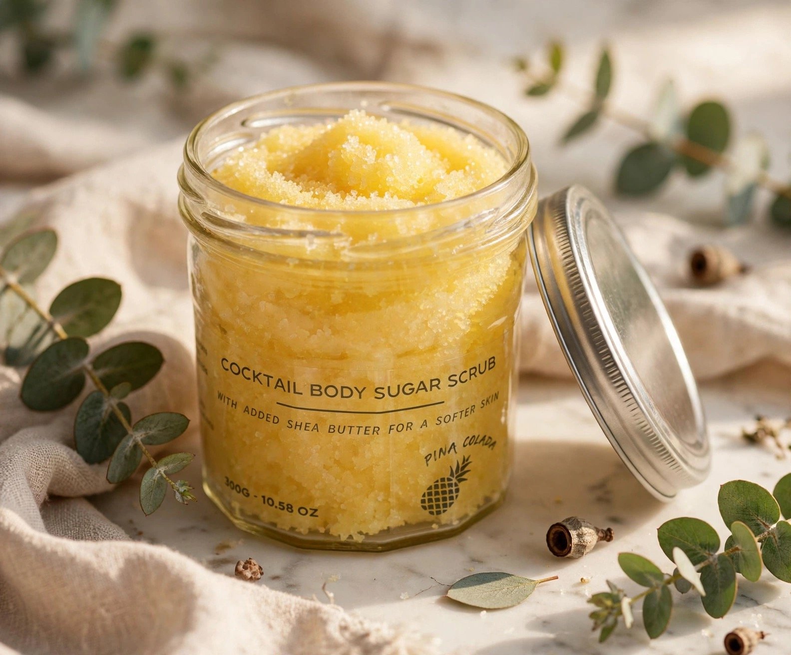 Pina Colada fragranced sugar body scrub in an open jar