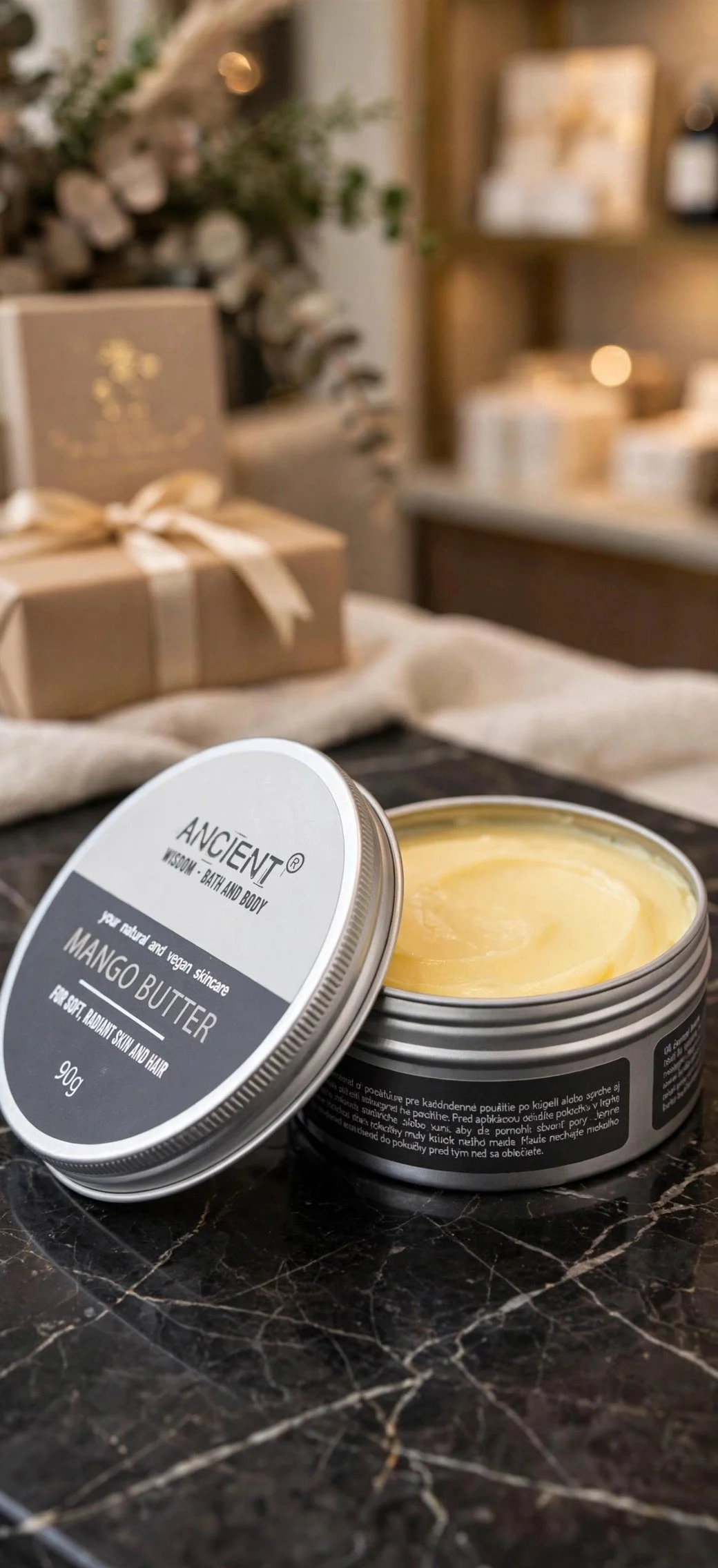 Open tin of pure mango body butter
