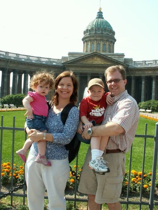 The Sullivan family in front of Kazan Cathedral in St. Petersburg, Russia, with their two young children.