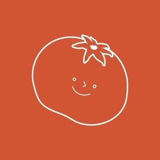 Cute illustration of a smiling tomato with a face and a leafy green top on an orange background.