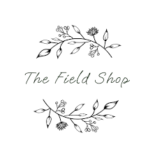 Elegant logo for The Field Shop featuring botanical illustrations with leaves and flowers, and cursive text